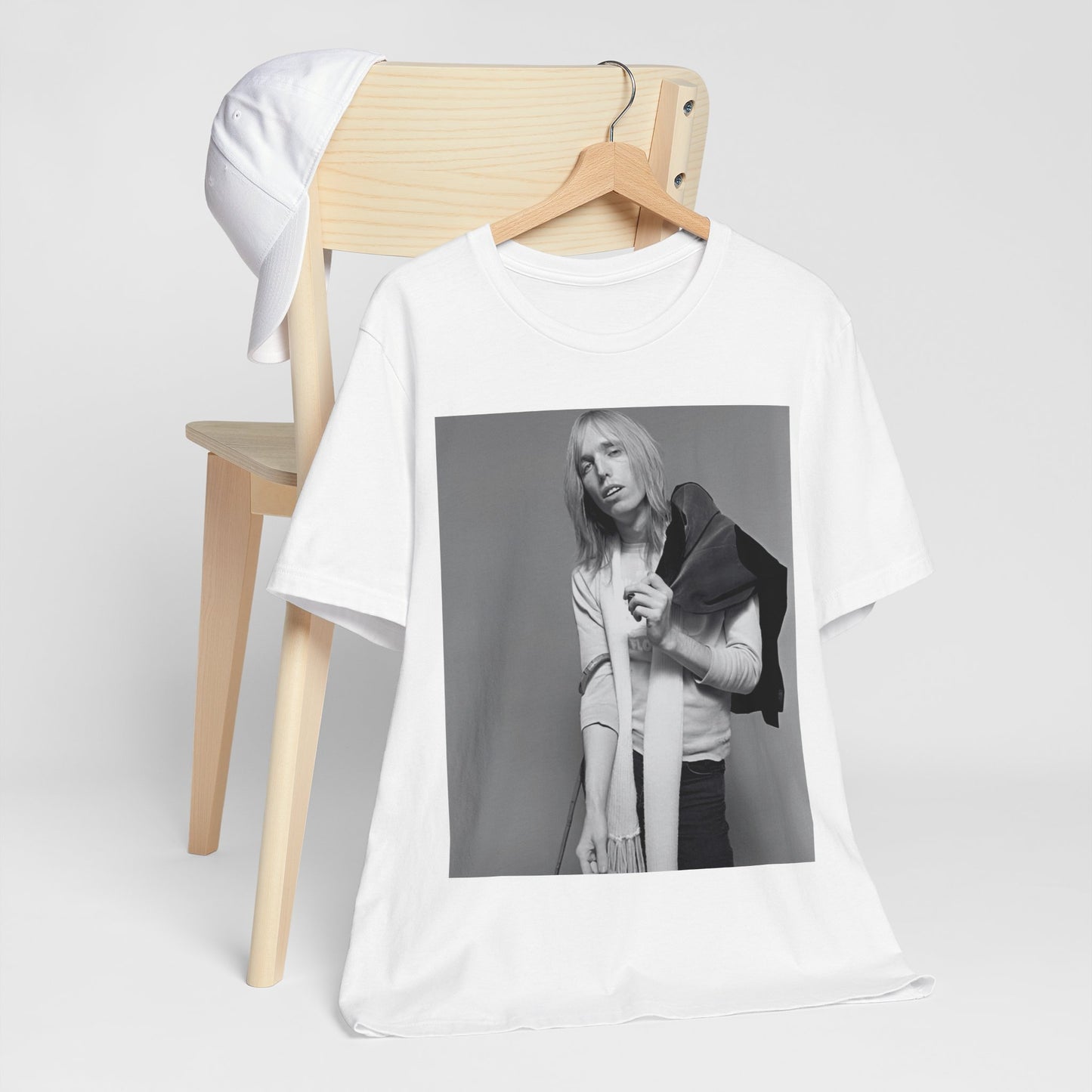 A black graphic t-shirt featuring a modern rock essential graphic of Tom Petty.