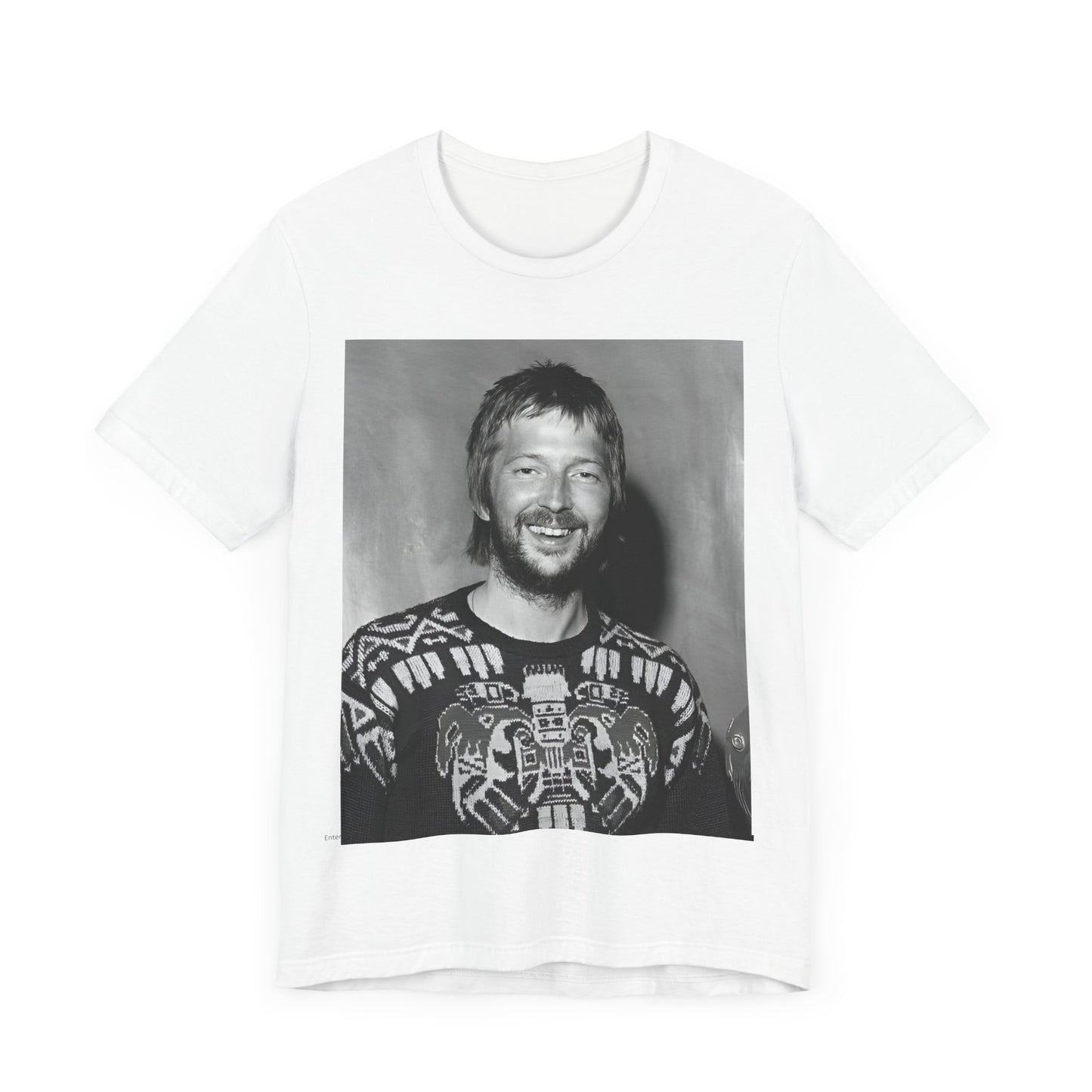 A black graphic t-shirt featuring a 70s photo portrait of Eric Clapton.