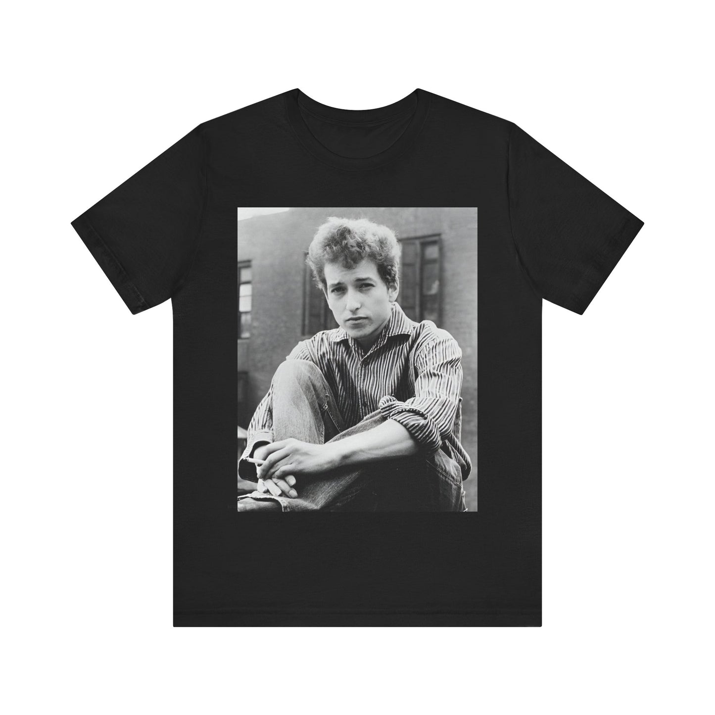 A black graphic t-shirt featuring a graphic of Bob Dylan from his 60s origins in folk music.