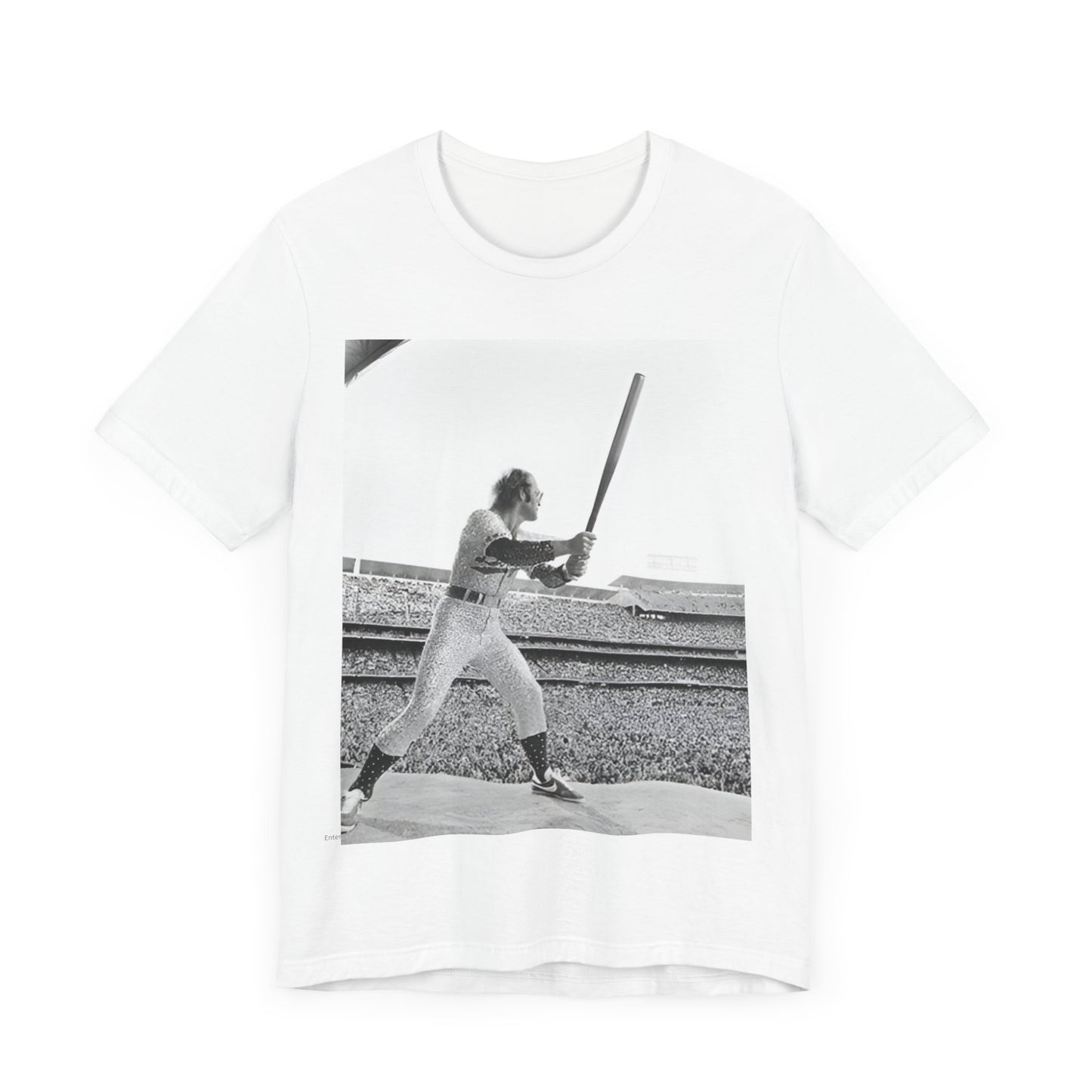 A black graphic t-shirt featuring a black and white graphic or photo related to Elton John's 1975 tour in America.