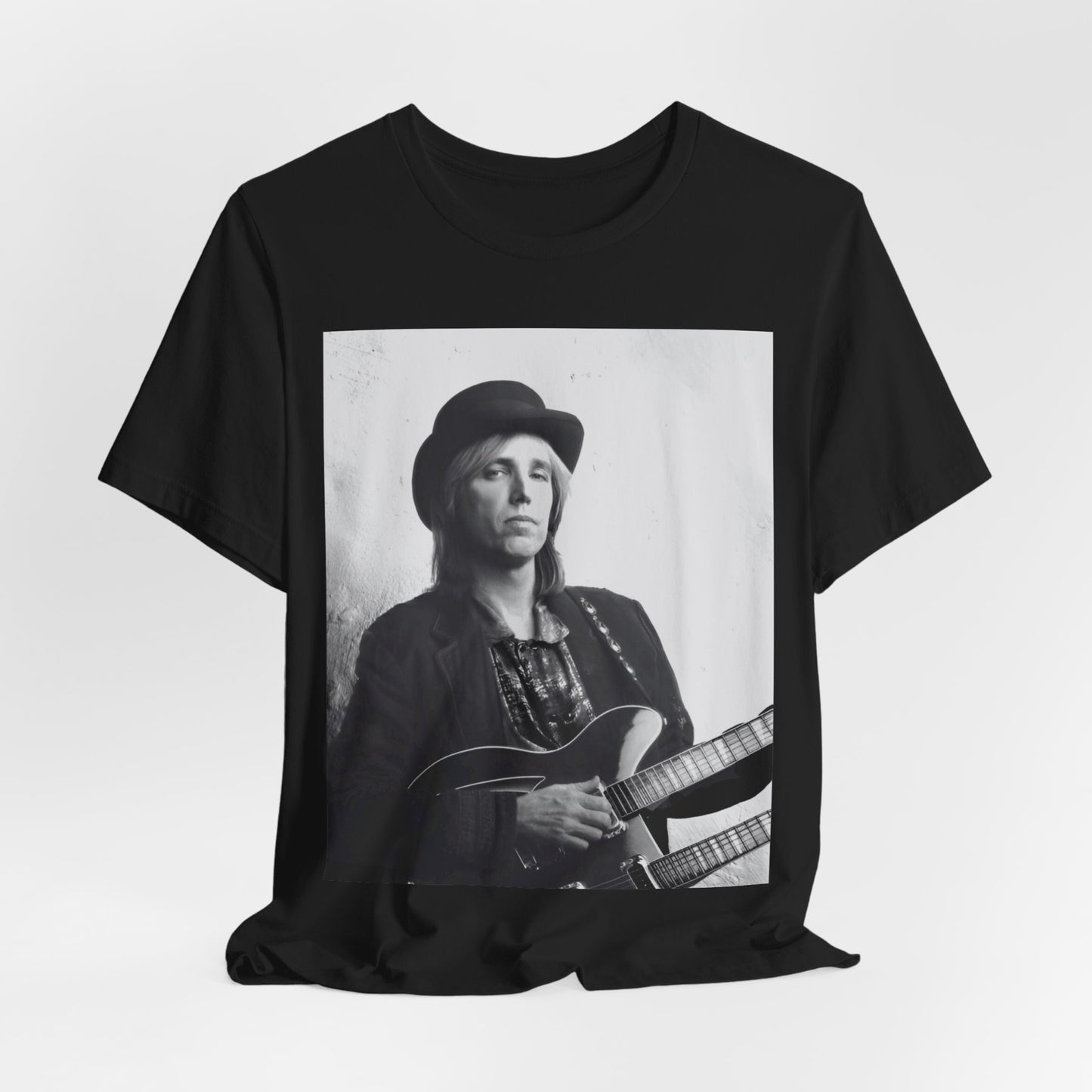A black graphic t-shirt featuring a graphic related to Tom Petty's 'Wildflowers' album era.