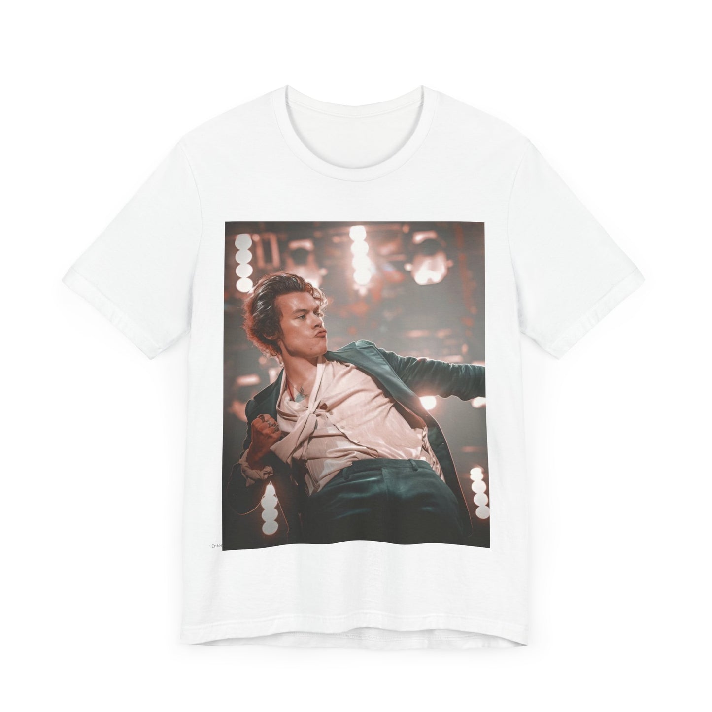 A black graphic t-shirt featuring a graphic or photo of Harry Styles performing live on concert tour.