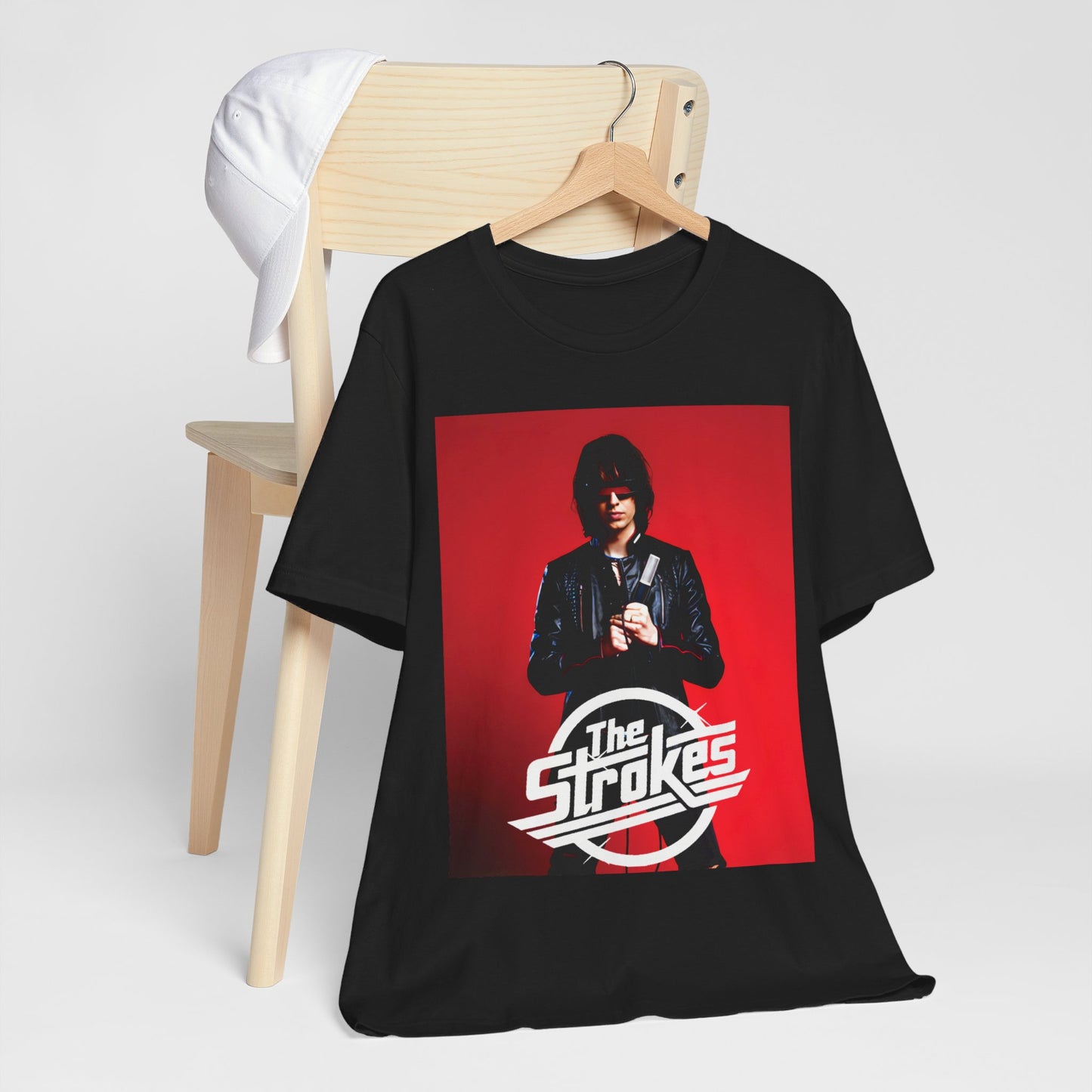 A black graphic t-shirt featuring a bold indie rock superstar graphic of The Strokes.