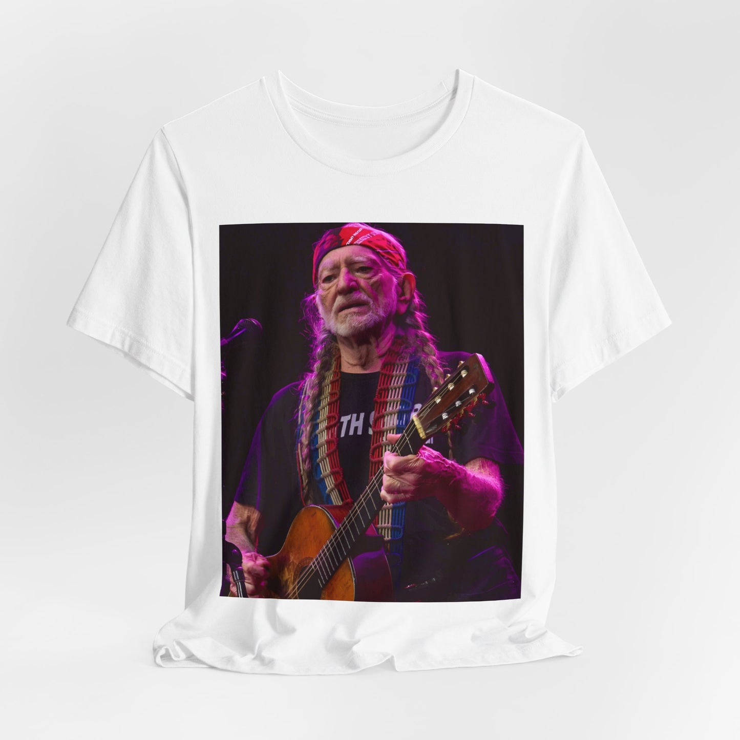 A black graphic t-shirt featuring an outlaw country legend graphic of Willie Nelson.