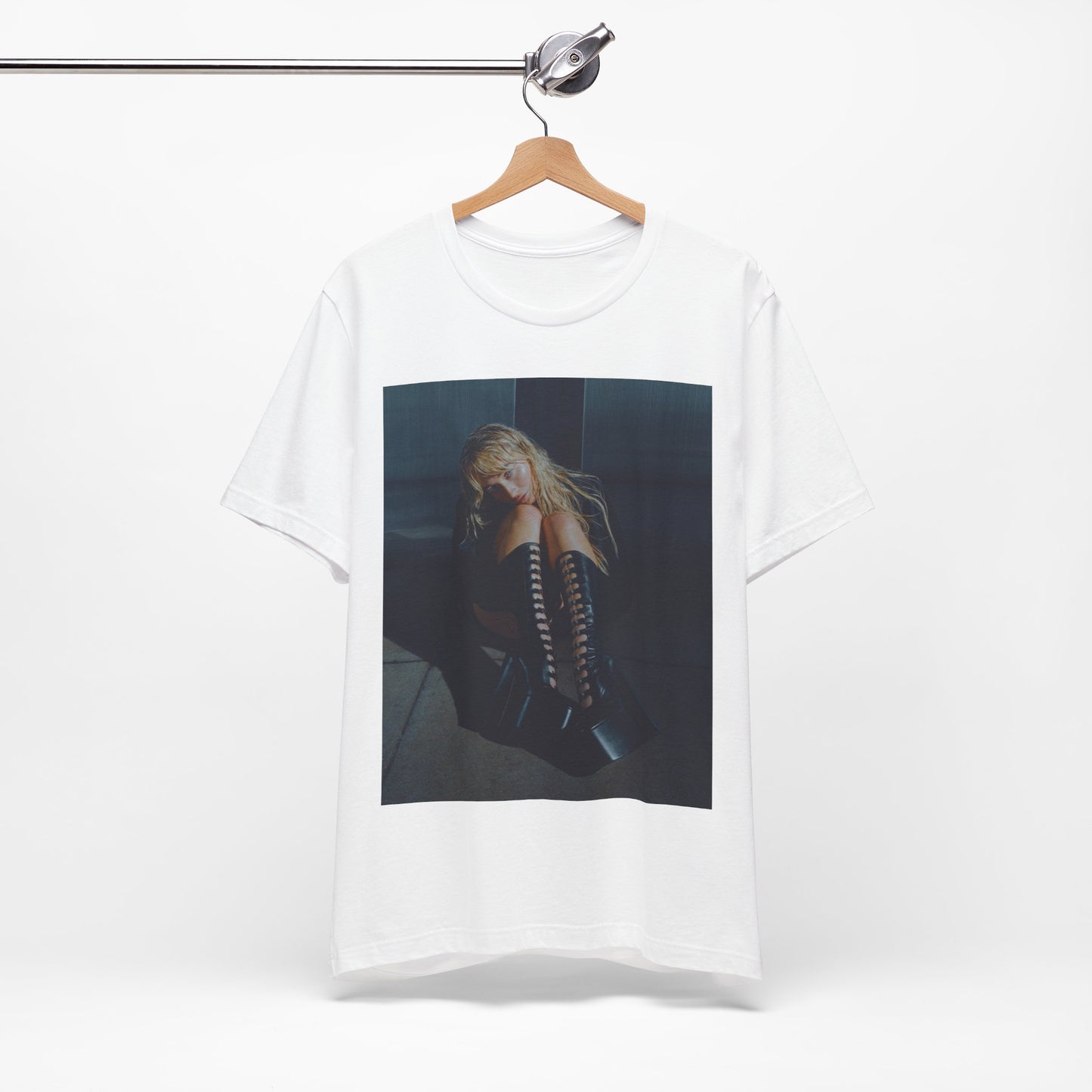 A black graphic t-shirt featuring a bold graphic of Sabrina Carpenter as a pop superstar.