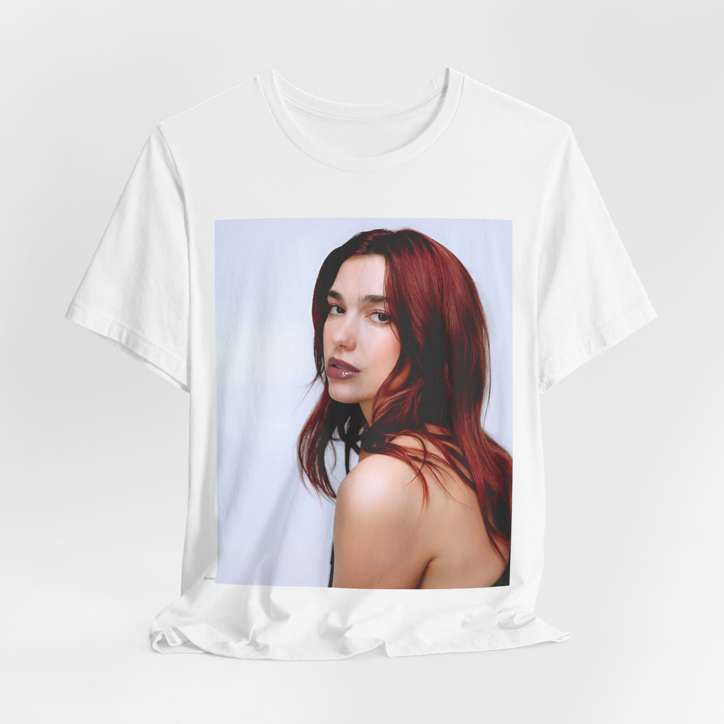 A black graphic t-shirt featuring a retro graphic inspired by Dua Lipa's "Don't Start Now" song.