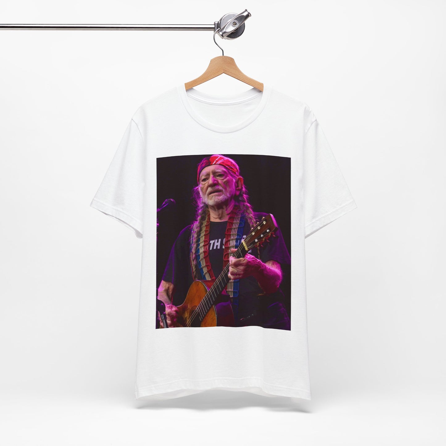 A black graphic t-shirt featuring an outlaw country legend graphic of Willie Nelson.