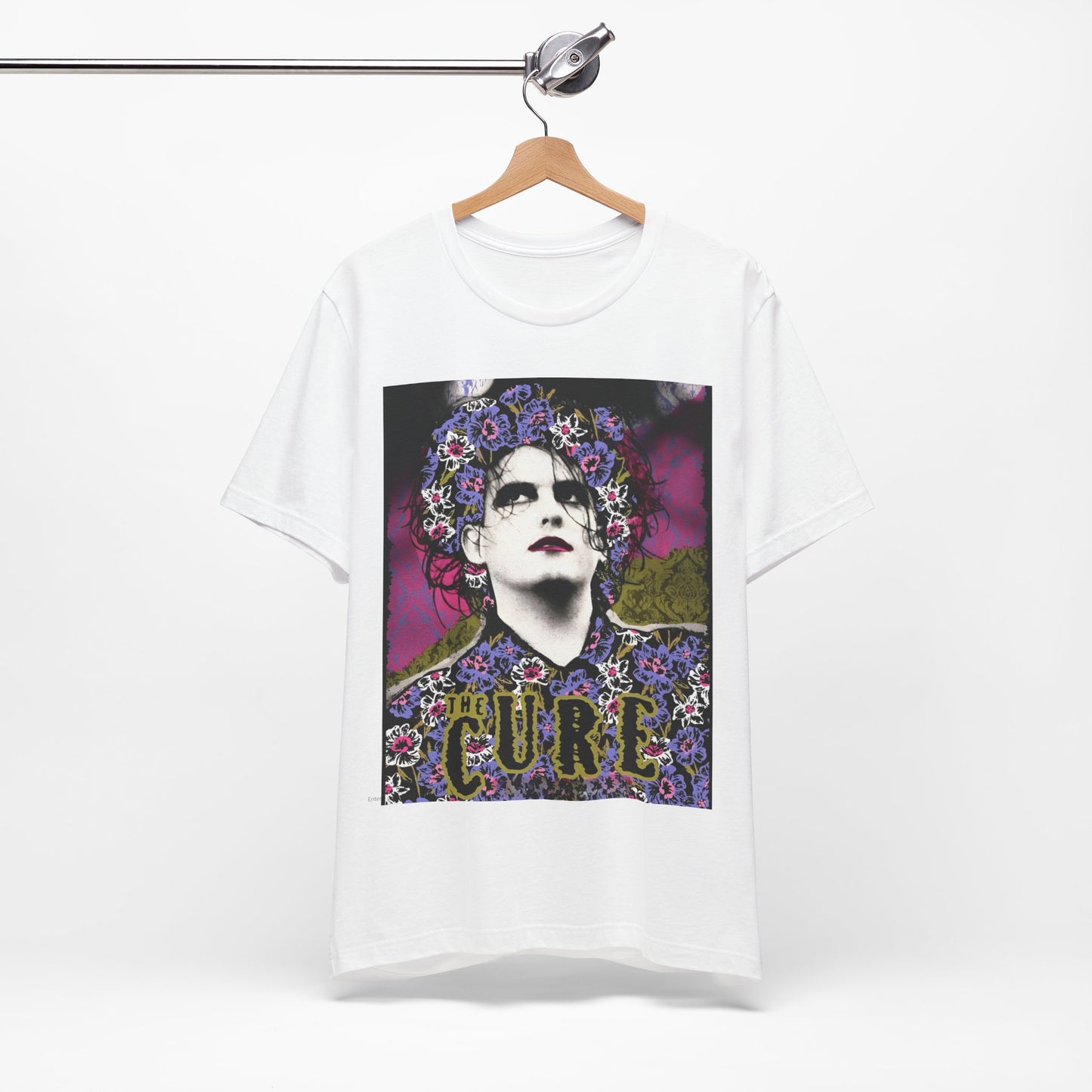 A black graphic t-shirt featuring a retro rock aesthetic pop art graphic of The Cure.