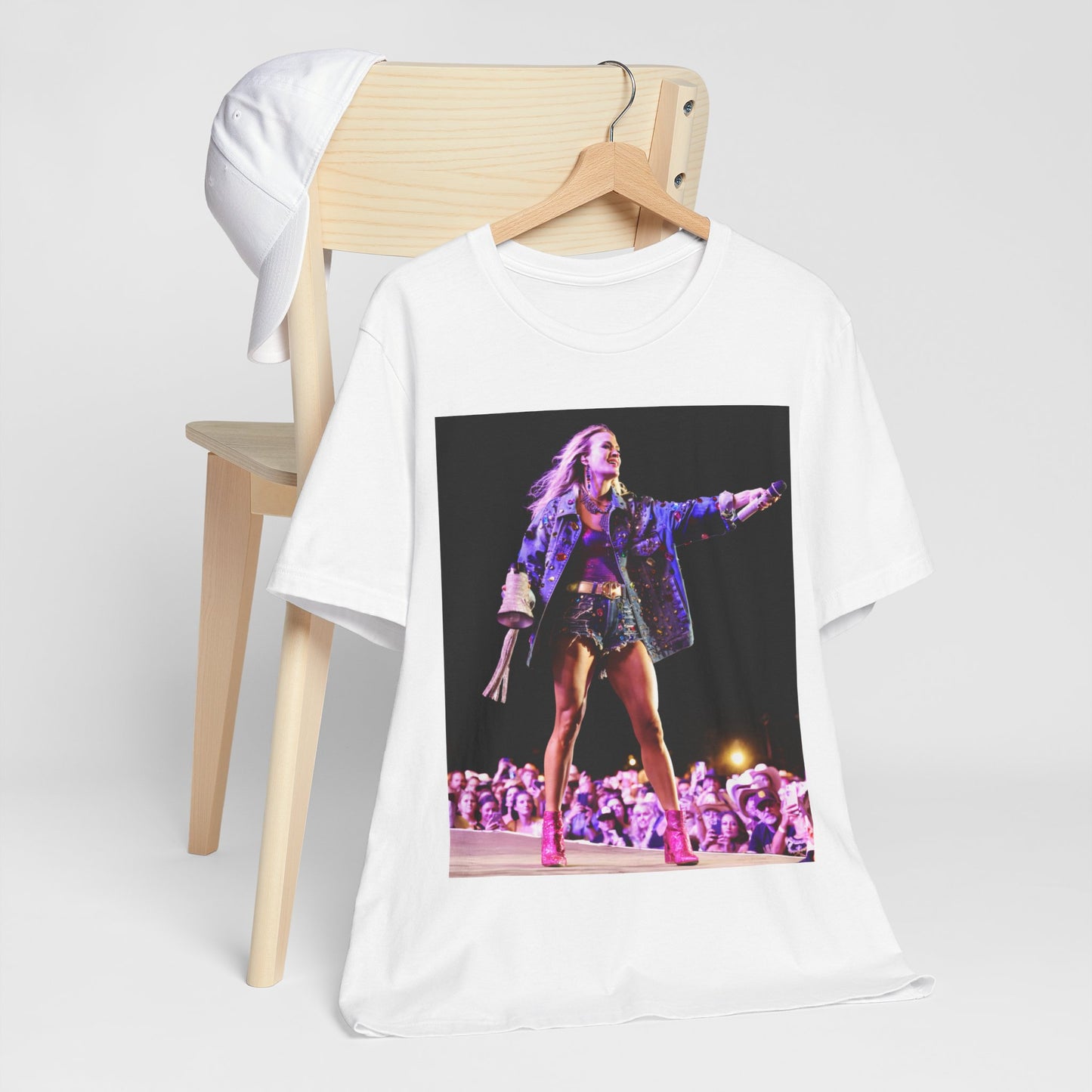A black graphic t-shirt featuring a graphic of Carrie Underwood with Nashville-themed elements or skyline.