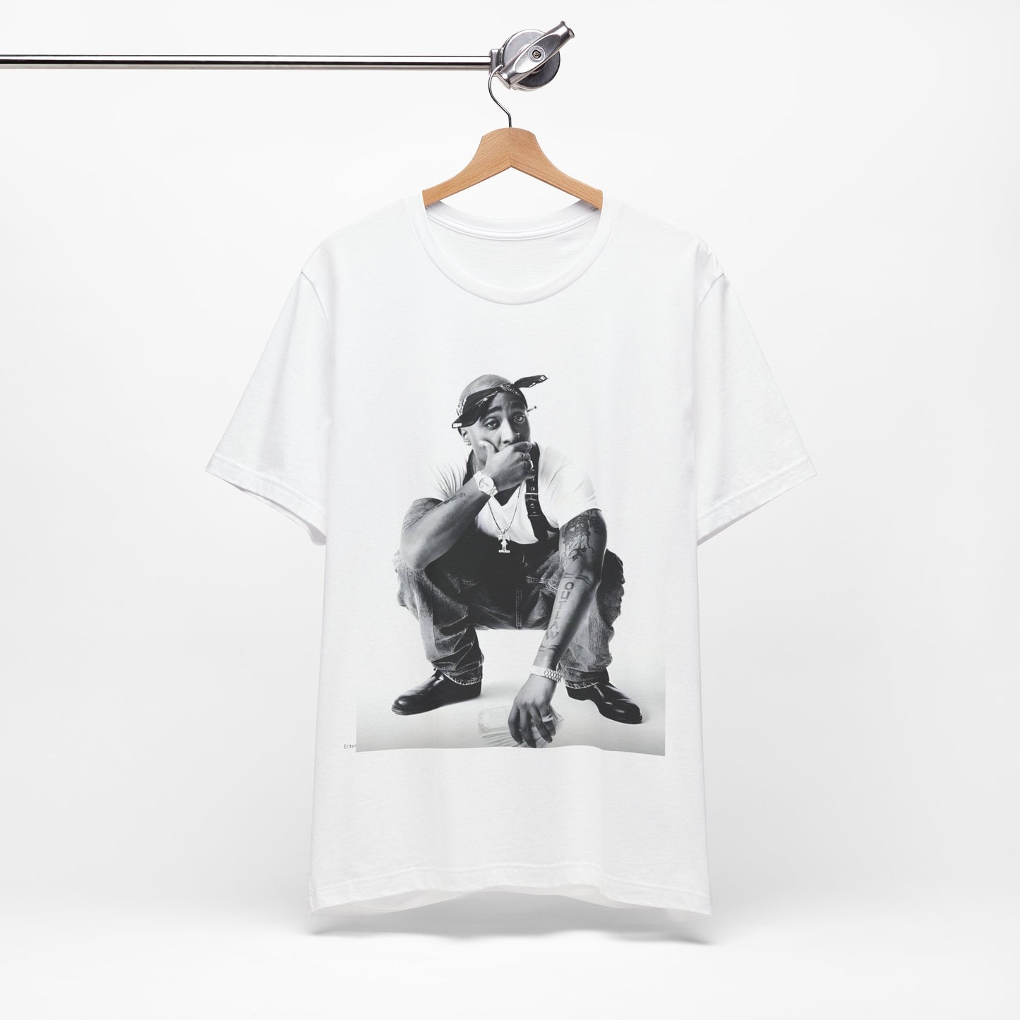 A black graphic t-shirt featuring a graphic of Tupac with a conscious rap vibe.