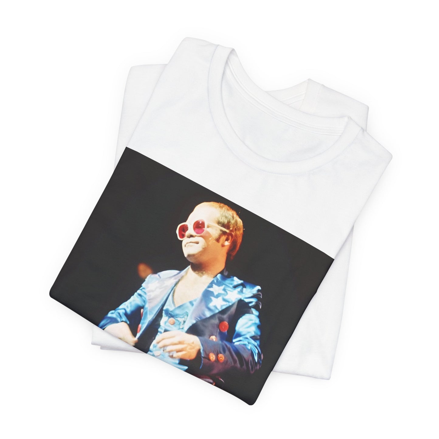 A black graphic t-shirt featuring a graphic related to Elton John's 70s America tour.