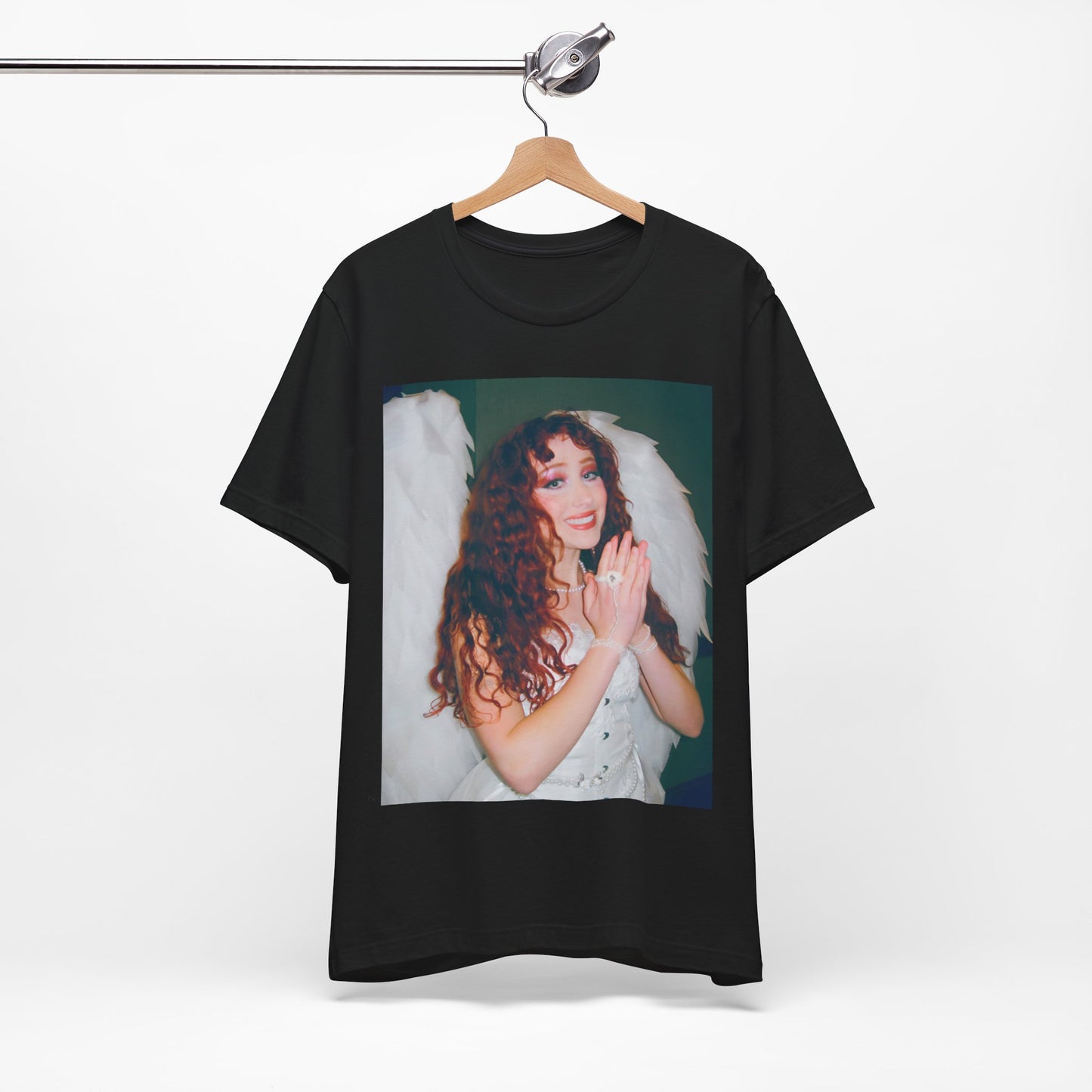 A black graphic t-shirt featuring a graphic of Chappell Roan, possibly with DIY or independent pop elements.