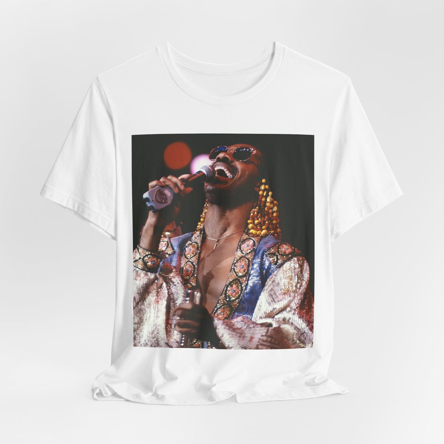 A black graphic t-shirt featuring a 70s vintage soul icon graphic of Stevie Wonder.