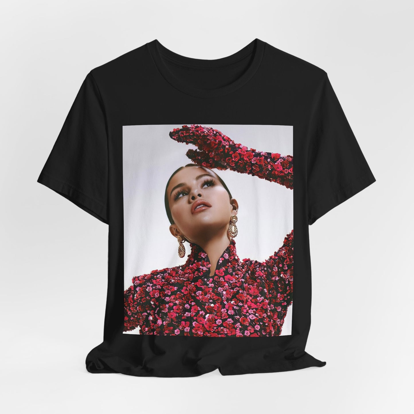 A black graphic t-shirt featuring a classic aesthetic graphic of Selena Gomez.