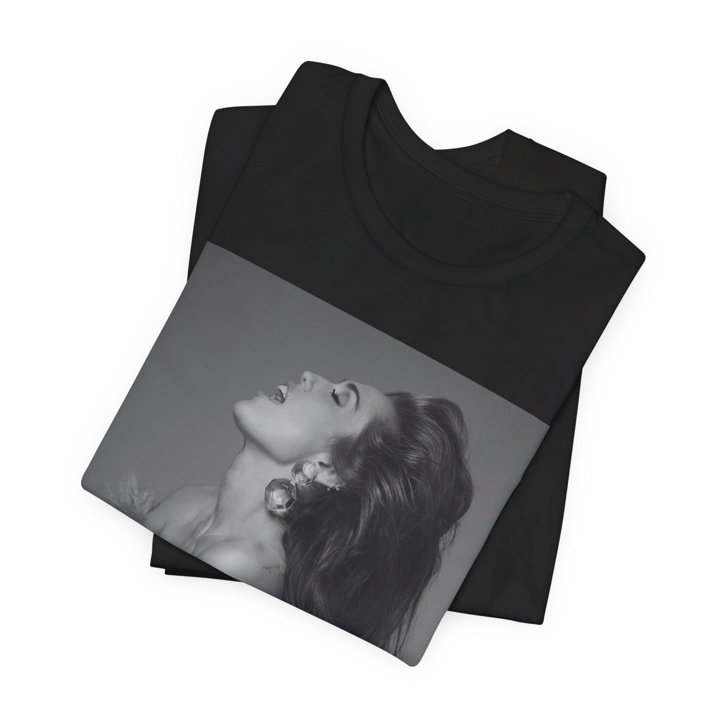 A black graphic t-shirt featuring a black and white portrait photo of Miley Cyrus.