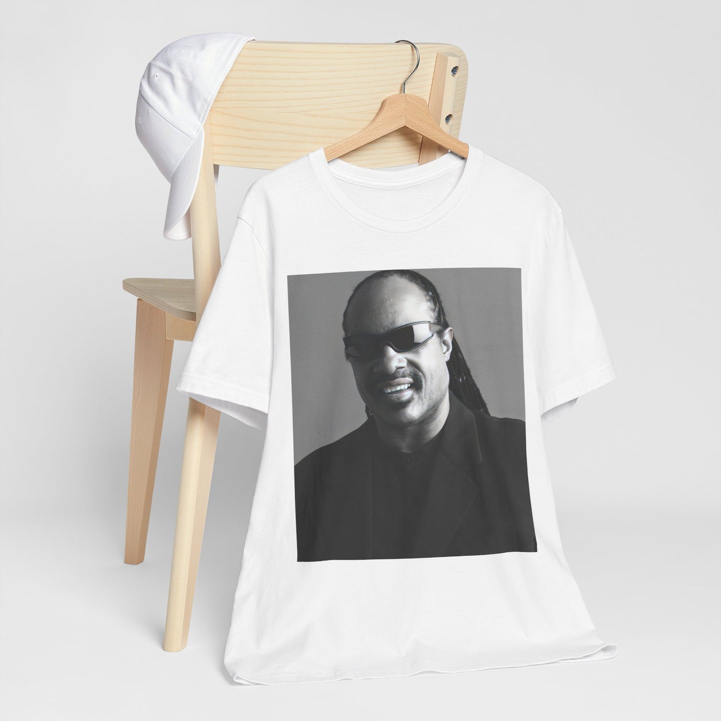 A black graphic t-shirt featuring a classic Motown legend black and white graphic of Stevie Wonder.