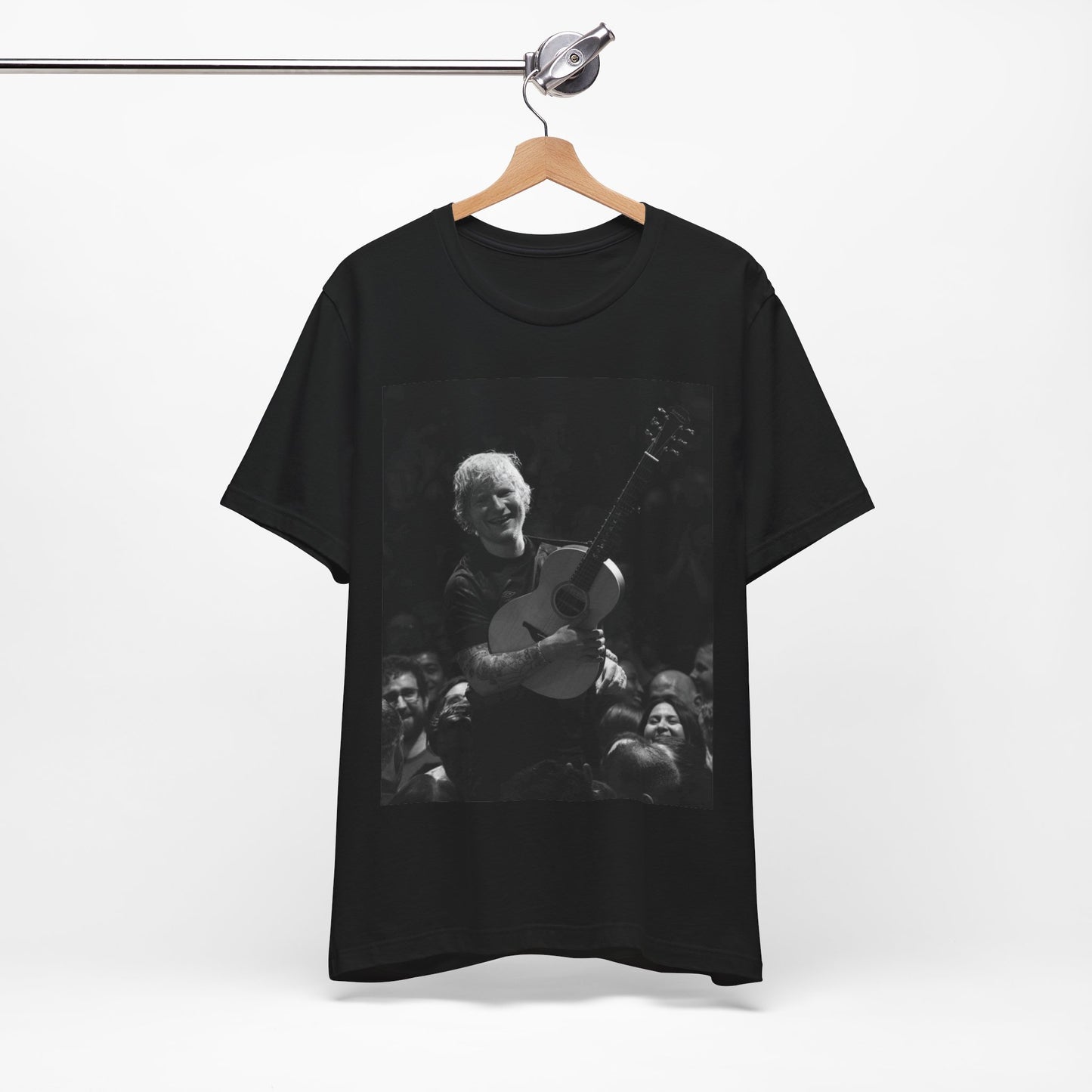A black graphic t-shirt featuring a photo of Ed Sheeran performing live with his guitar.