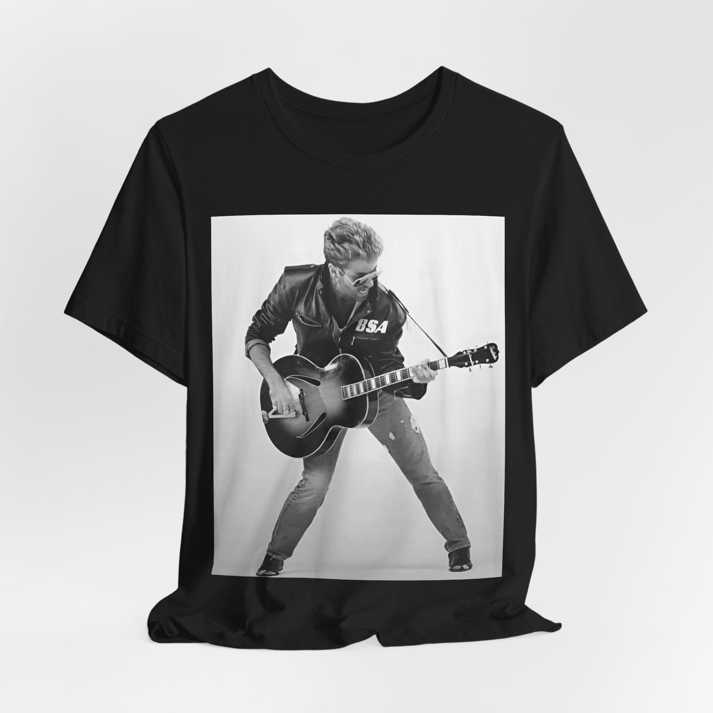 A black graphic t-shirt featuring a graphic of George Michael with a guitar.