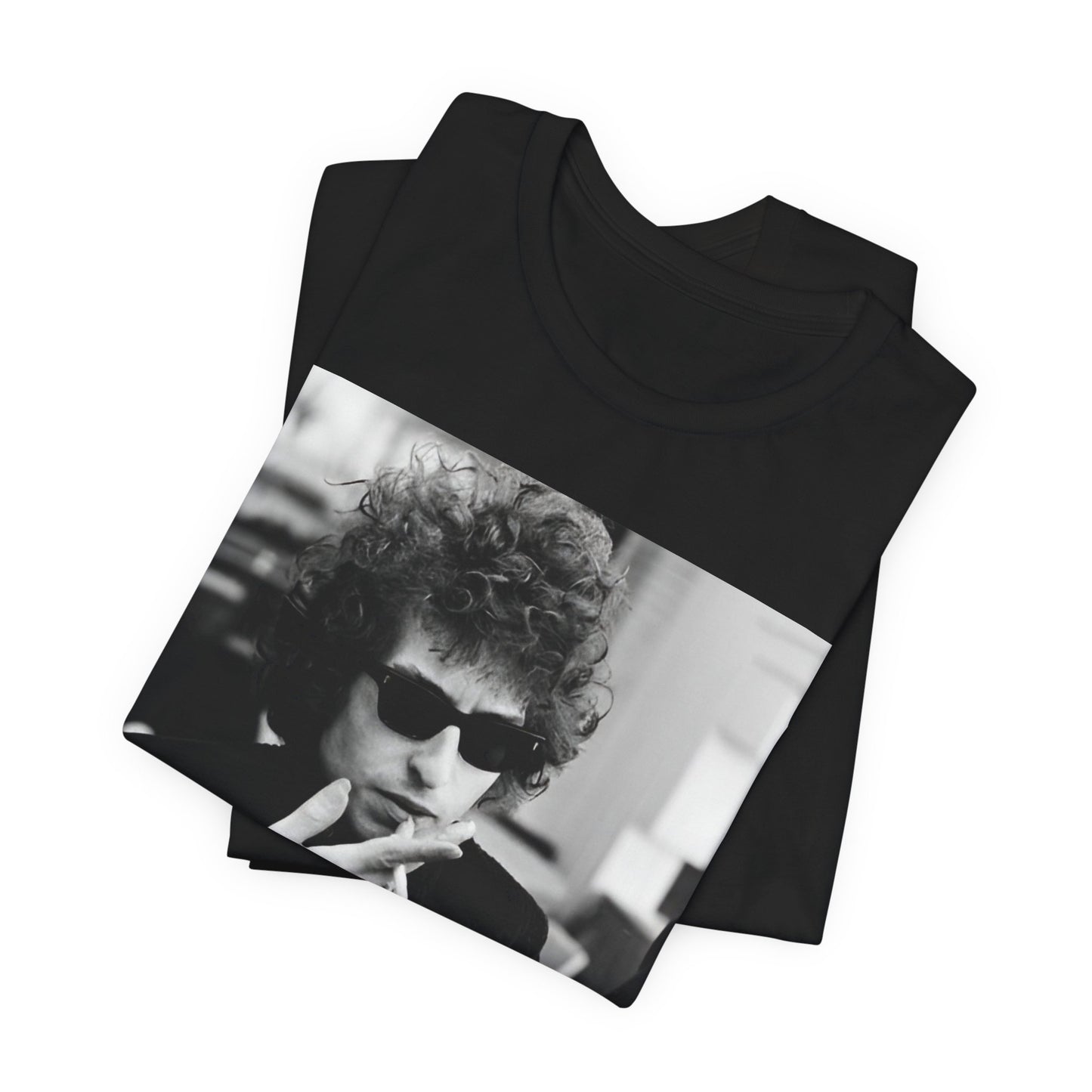 A black graphic t-shirt featuring a retro black and white graphic of Bob Dylan in a rebellious pose.
