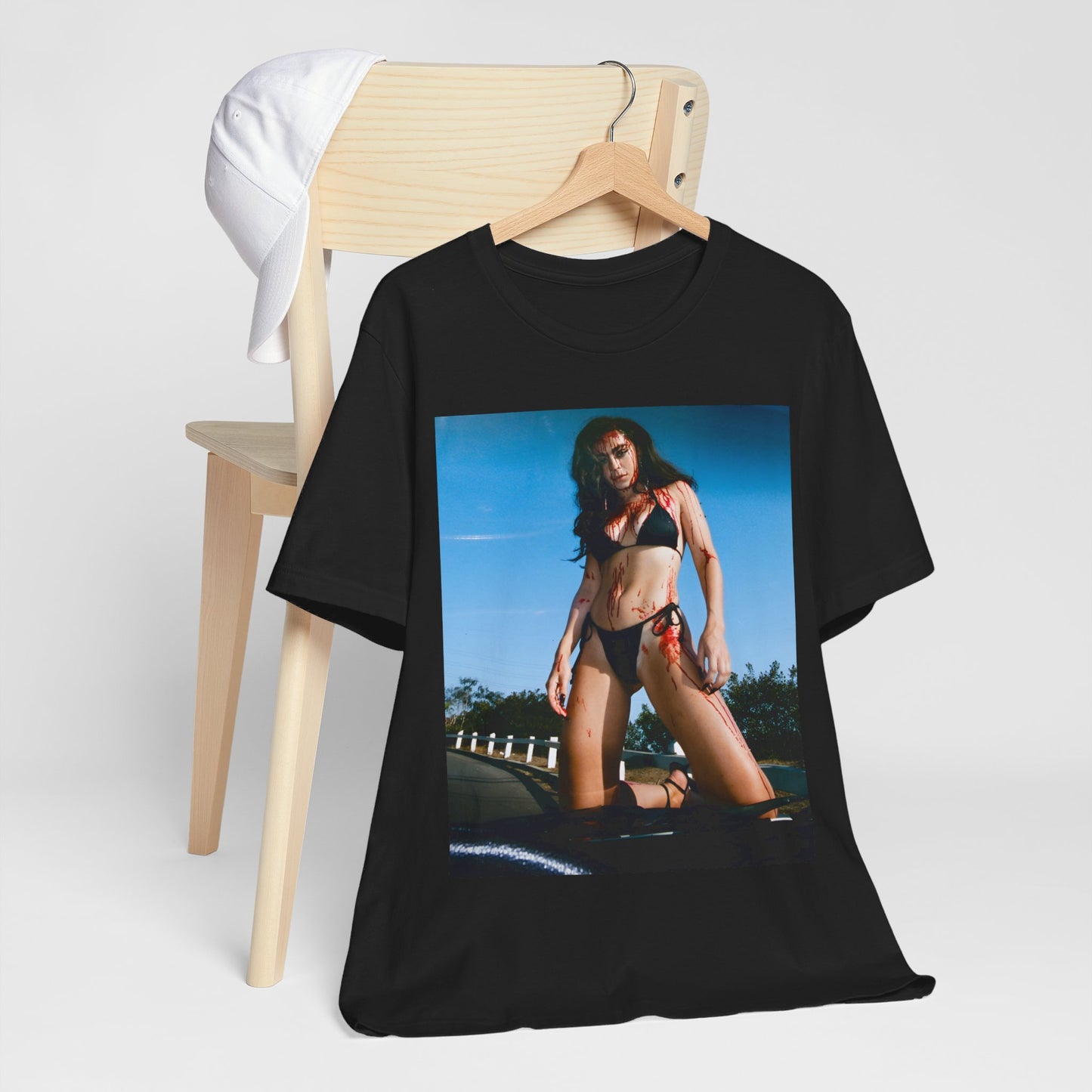 A black graphic t-shirt featuring the album cover art for Charli XCX's 'CRASH' album.