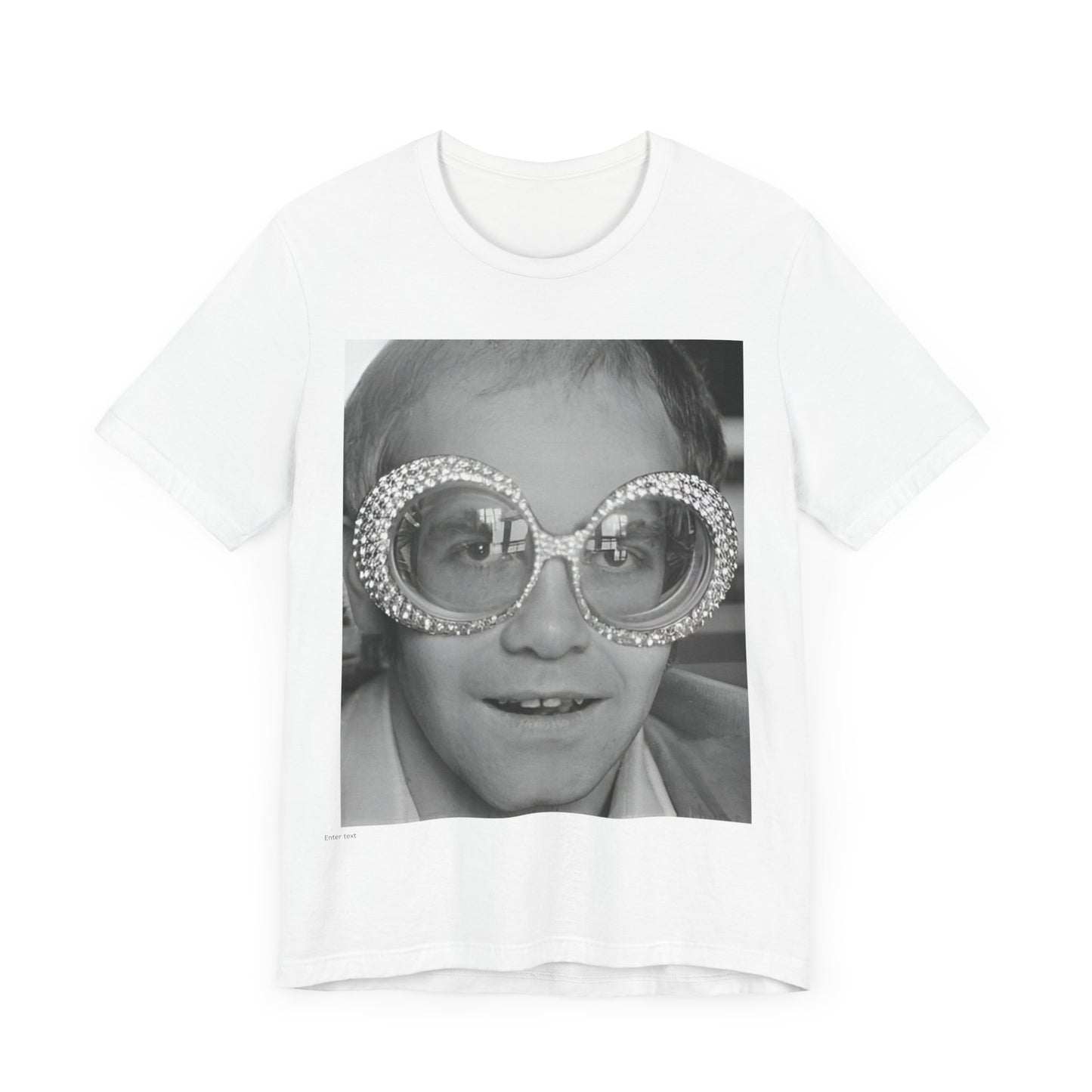 A black graphic t-shirt featuring a graphic of Elton John emphasizing his iconic glasses and fashion.