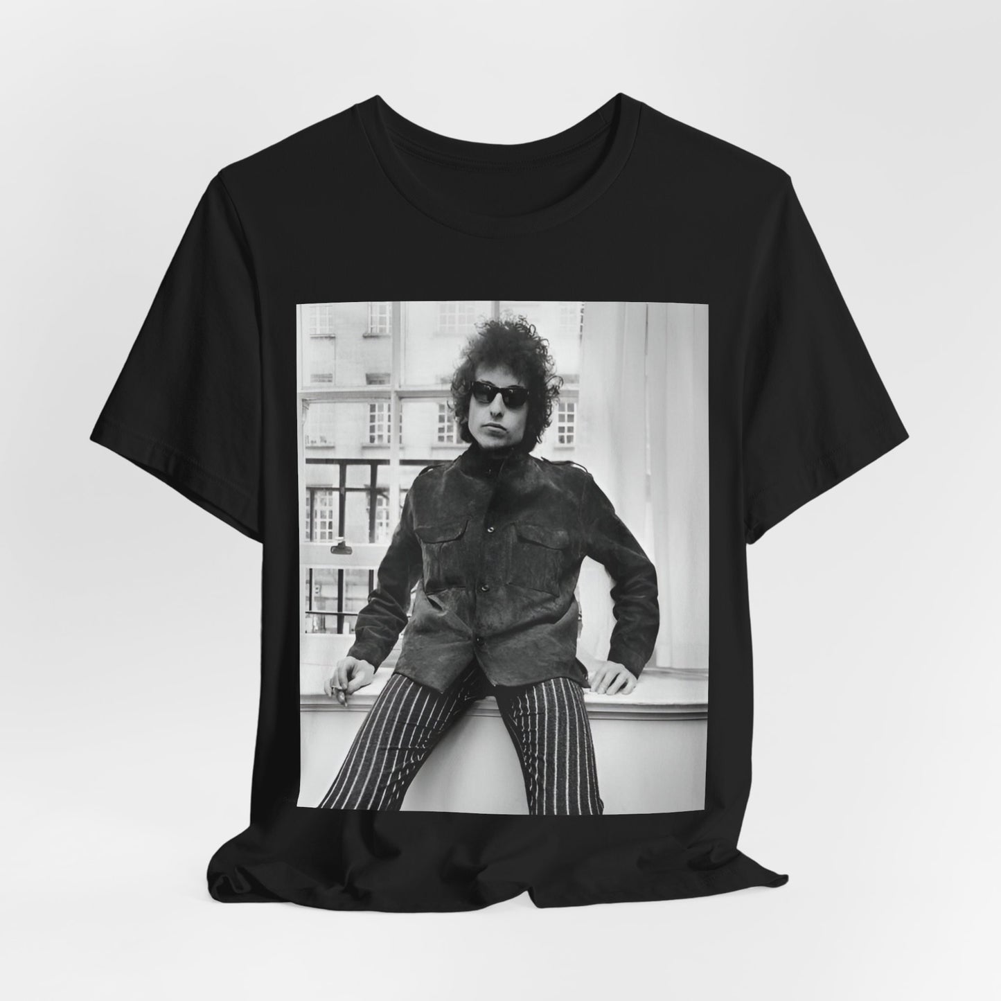A black graphic t-shirt featuring a graphic related to Bob Dylan's 'Highway 61' era, possibly with album art elements or iconic imagery.