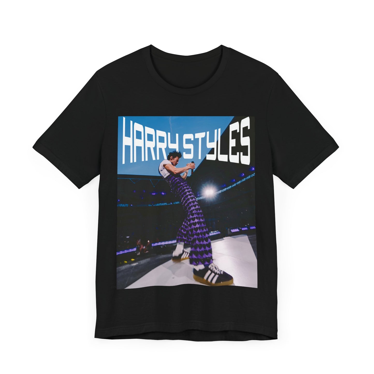 A black graphic t-shirt featuring a graphic or photo of Harry Styles performing live in concert.