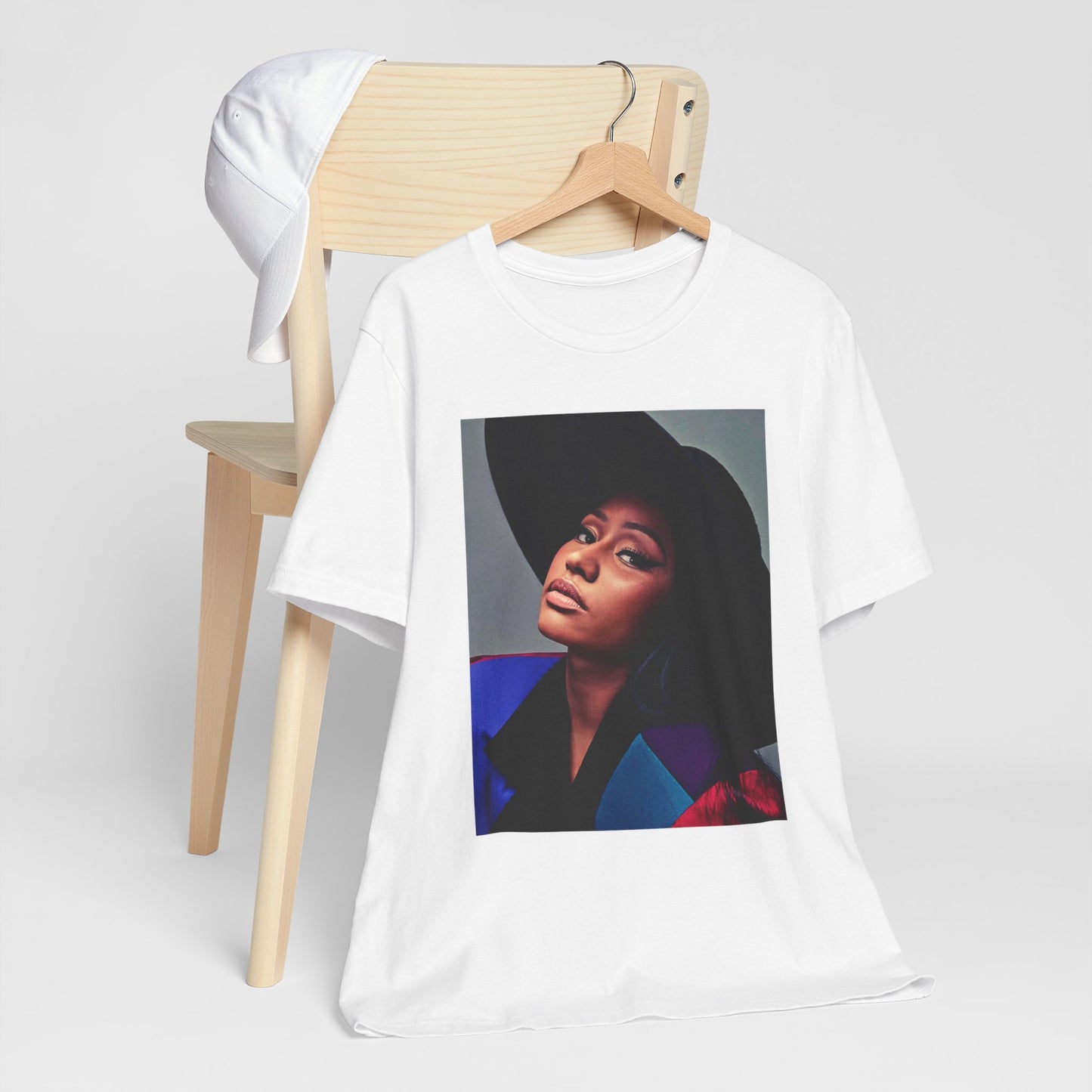A black graphic t-shirt featuring a graphic of Nicki Minaj as a streetwear icon.
