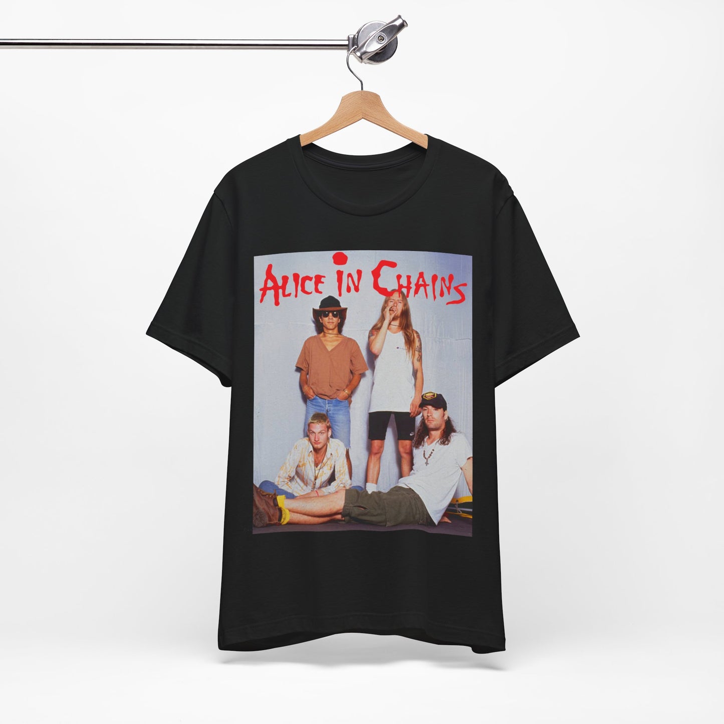 A black graphic t-shirt featuring a band graphic of Alice In Chains from 1990, capturing their early grunge aesthetic.