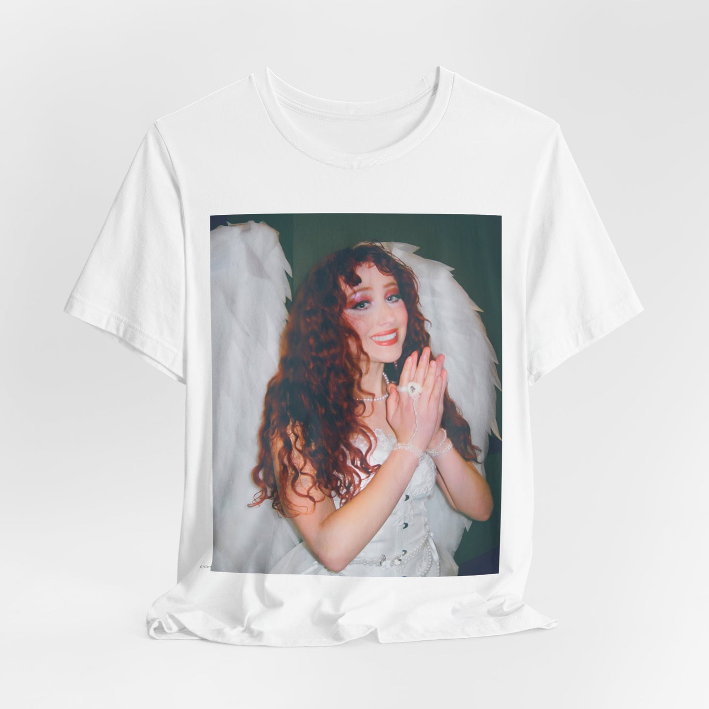 A black graphic t-shirt featuring a graphic of Chappell Roan, possibly with DIY or independent pop elements.
