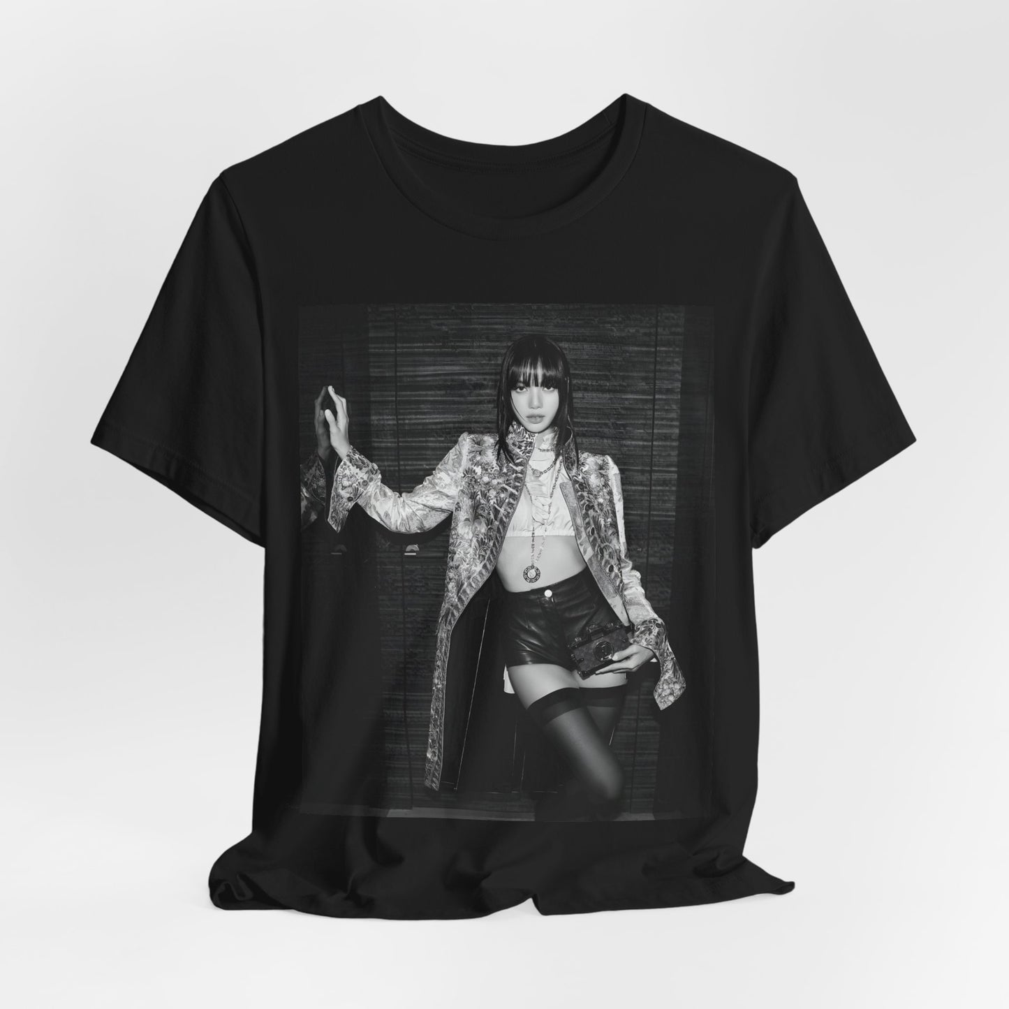 A black graphic t-shirt featuring a black and white, monochrome graphic or photo of Lisa.