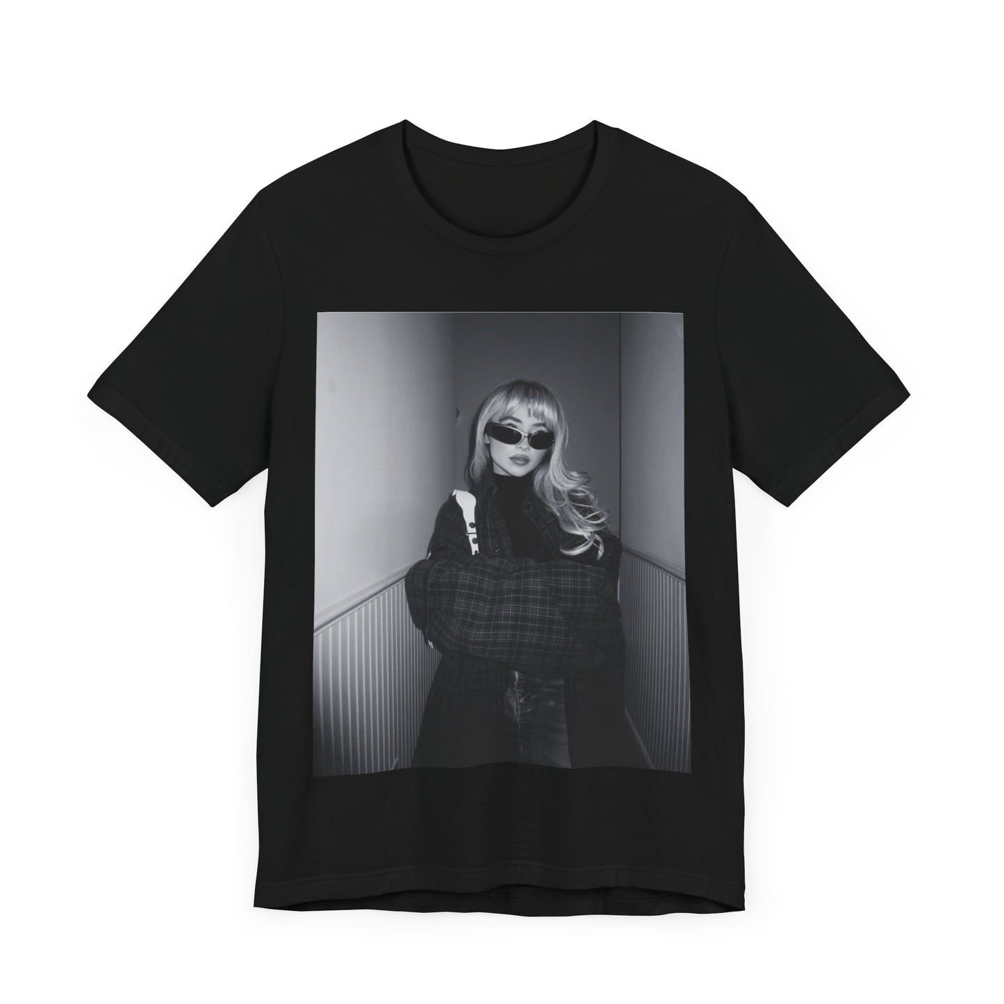 A black graphic t-shirt featuring a black and white glam pop diva graphic of Sabrina Carpenter.