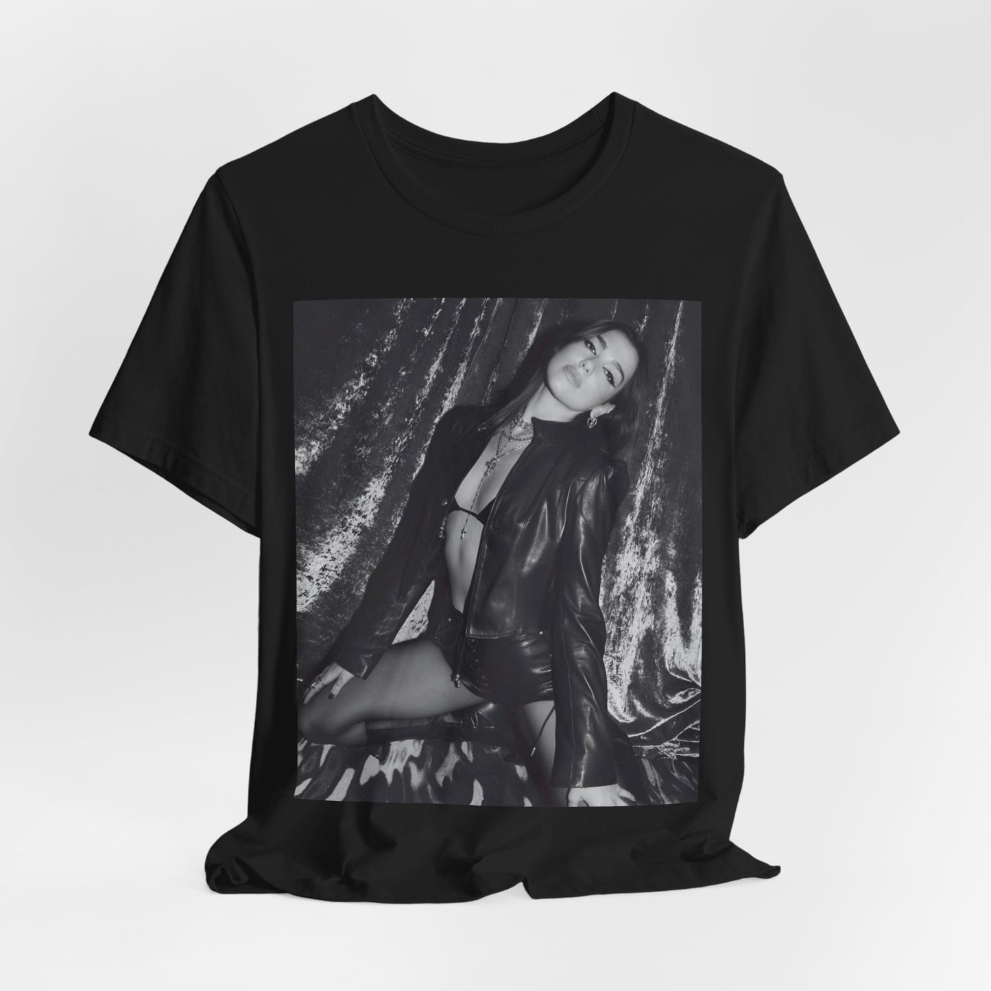 A black graphic t-shirt featuring a black and white portrait photo of Dua Lipa.
