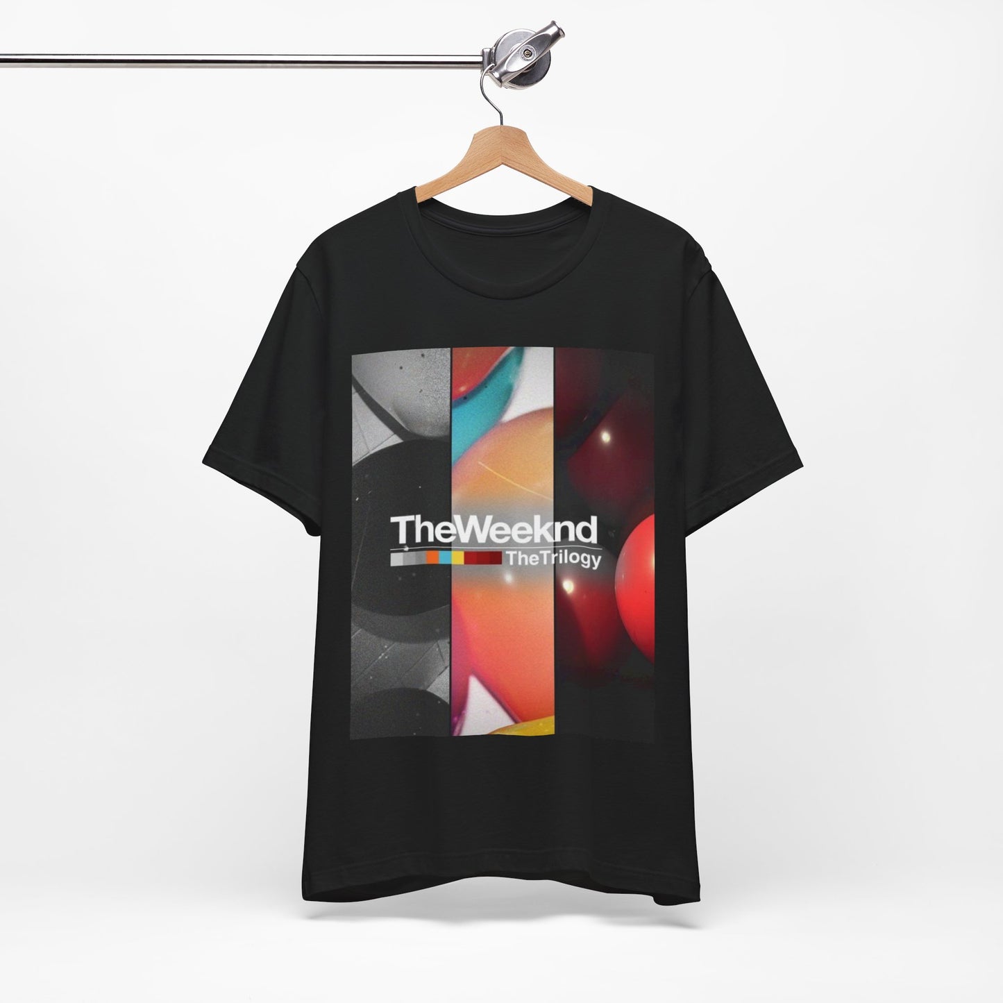 A black graphic t-shirt featuring a graphic related to The Weeknd's 'The Trilogy' album.