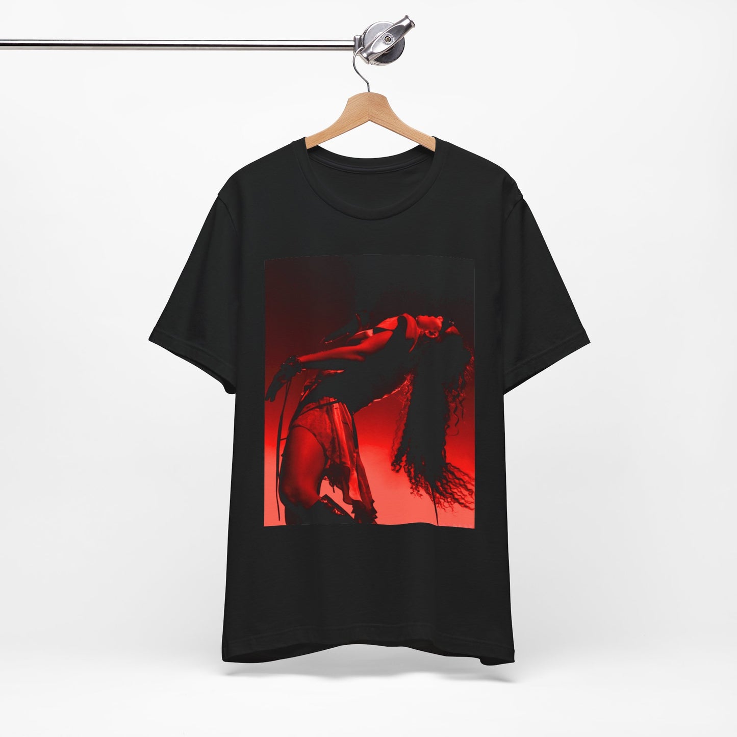 A black graphic t-shirt featuring a graphic of Charli XCX, designed with a future pop aesthetic.