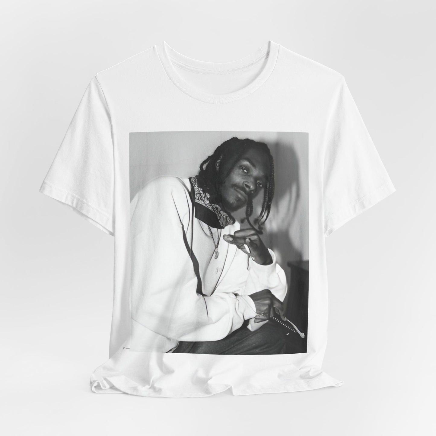 A black graphic t-shirt featuring a black and white hip hop graphic or photo of Snoop Dogg.