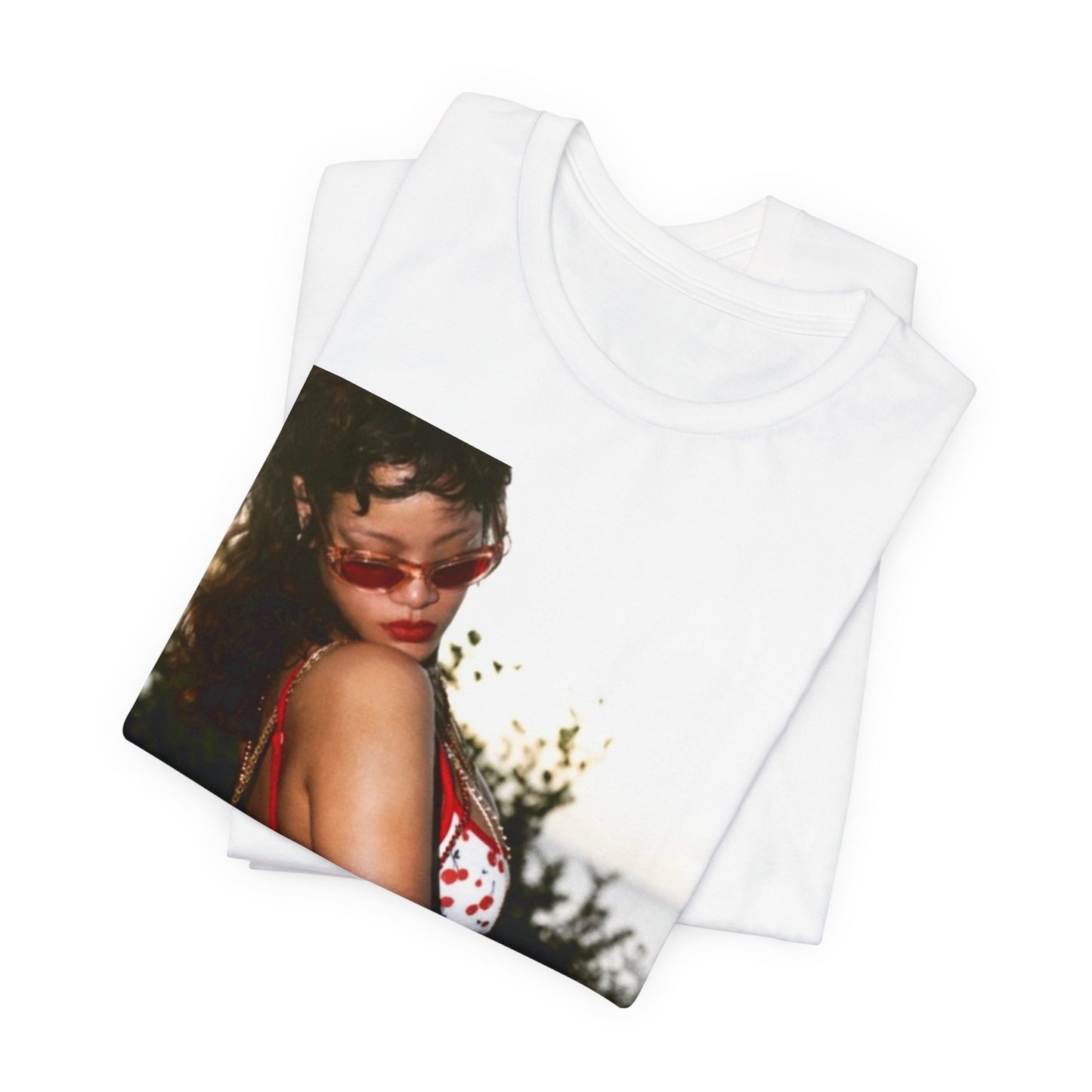 A black graphic t-shirt featuring a photo graphic of Rihanna in a bikini.
