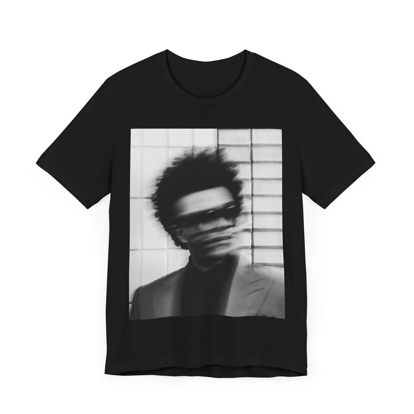 A black graphic t-shirt featuring a blurred graphic of The Weeknd from his 'After Hours' era.