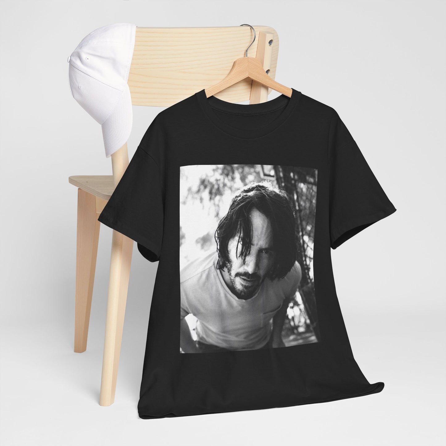 A black graphic t-shirt featuring a graphic of Keanu Reeves with authentic chill vibes.