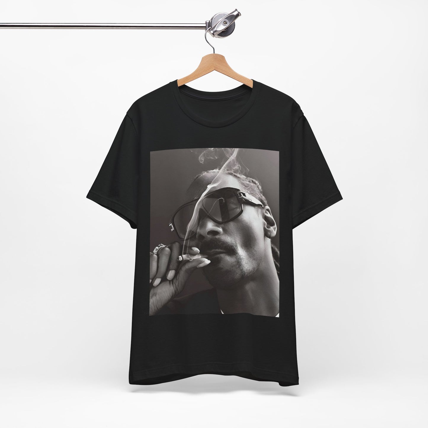 A black graphic t-shirt featuring an iconic black and white shaded portrait graphic of Snoop Dogg.