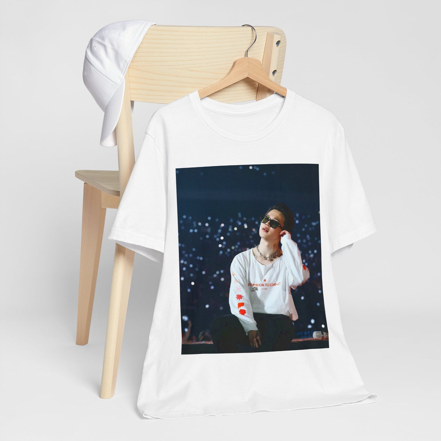 A black graphic t-shirt featuring a vintage aesthetic graphic related to Jimin's 'Lie' era.