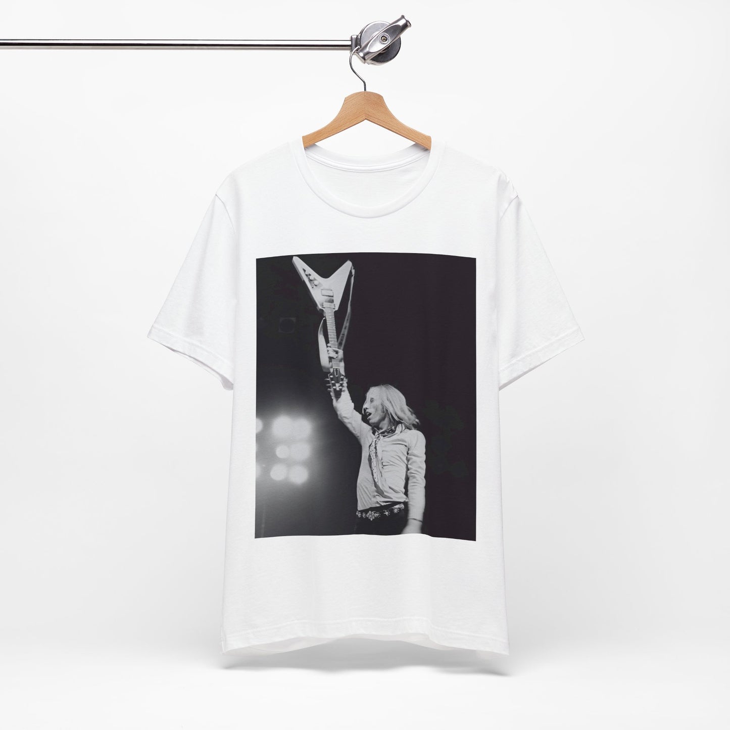 A black graphic t-shirt featuring a graphic or photo of Tom Petty playing guitar on stage.