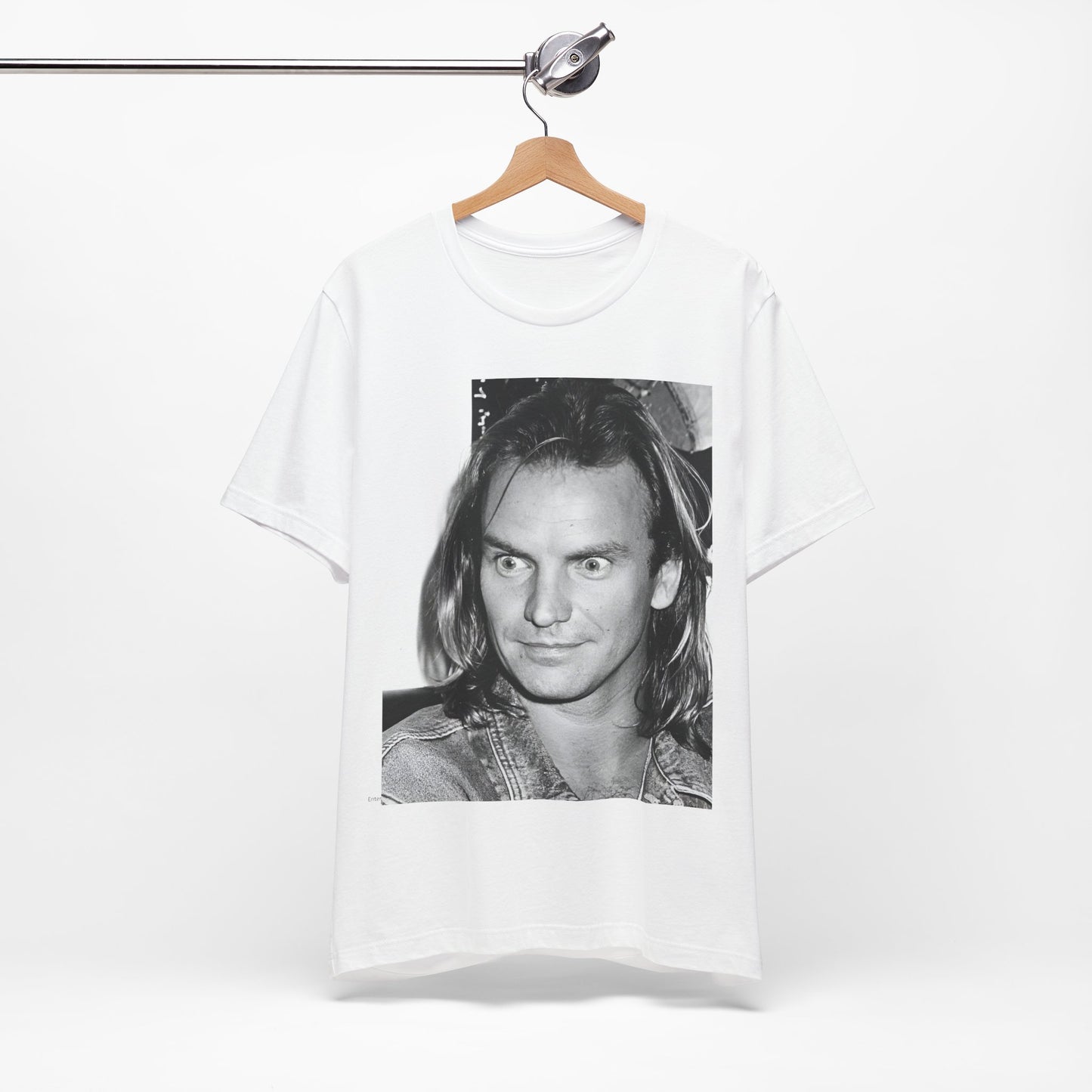 A black graphic t-shirt featuring a retro graphic related to Sting's 'Synchronicity' album era.