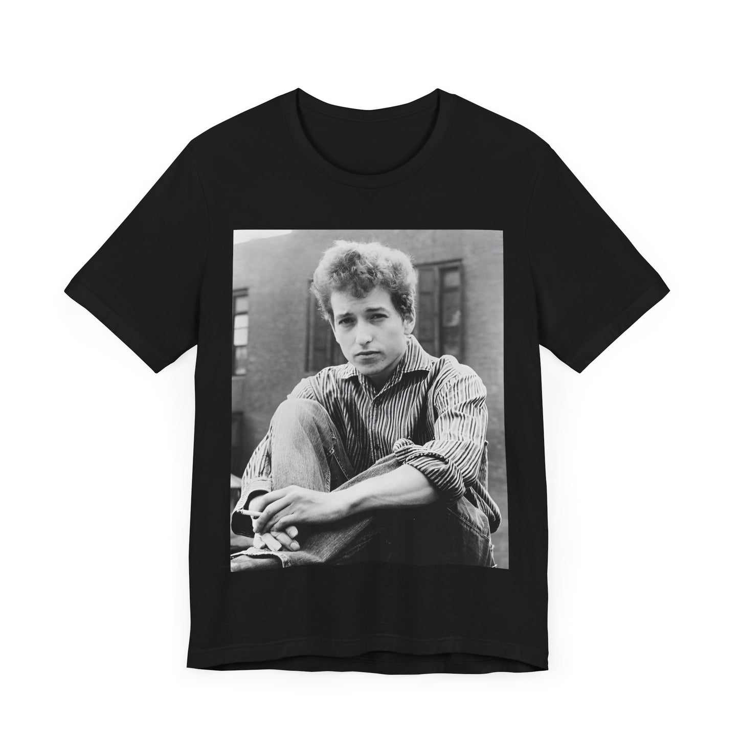 A black graphic t-shirt featuring a graphic of Bob Dylan from his 60s origins in folk music.