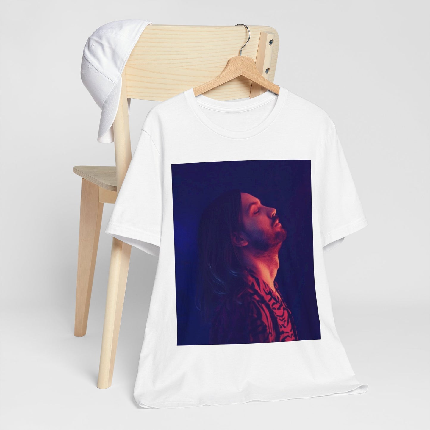 A black graphic t-shirt featuring a retro indie alt-rock graphic of Tame Impala.