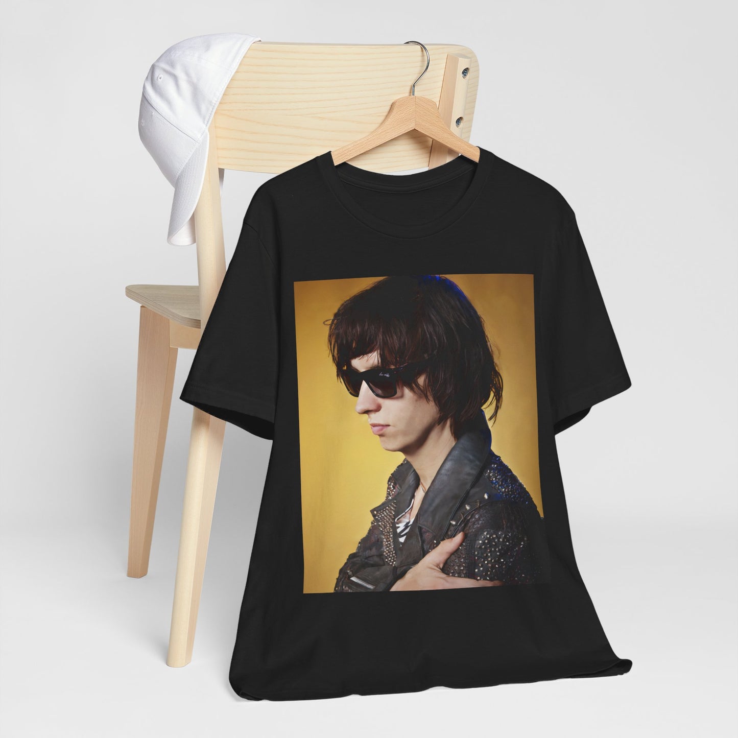A black graphic t-shirt featuring a retro graphic related to The Strokes' 'Is This It' album era.