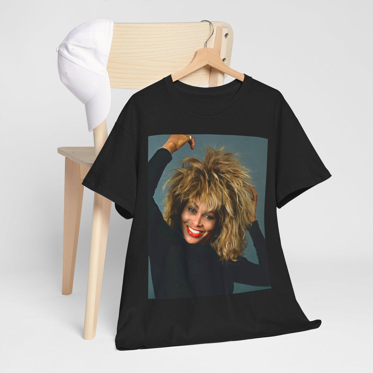 A black graphic t-shirt featuring a graphic related to Tina Turner's 'Private Dancer' album era.