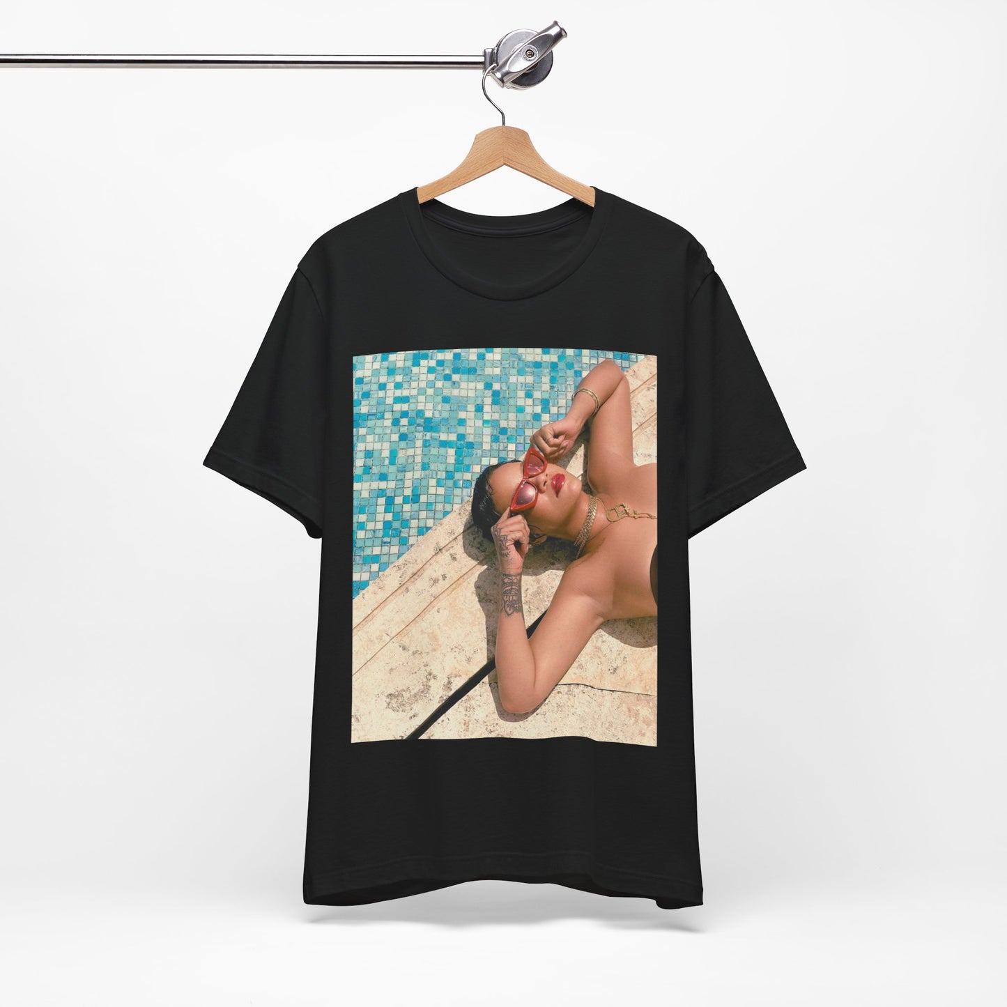 A black graphic t-shirt featuring a graphic of Rihanna in swimwear as a pop star queen.