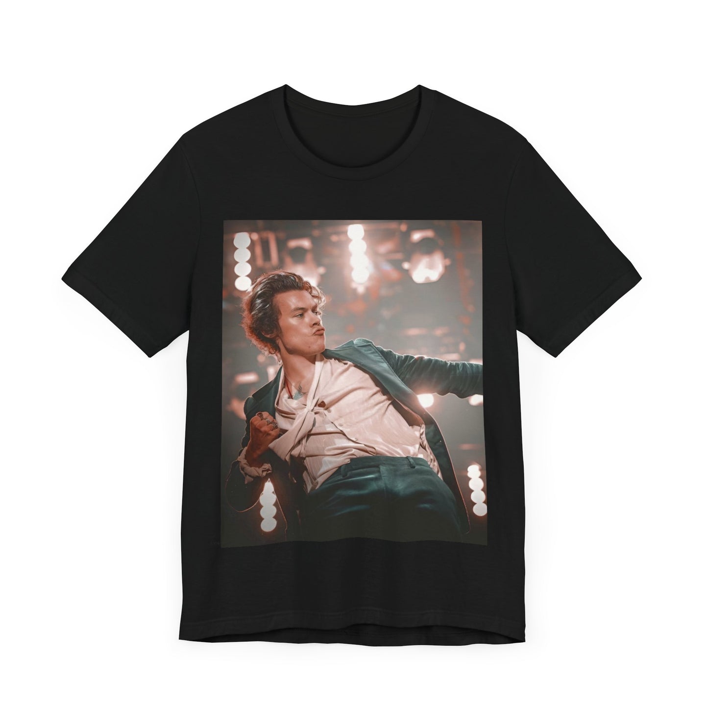 A black graphic t-shirt featuring a graphic or photo of Harry Styles performing live on concert tour.
