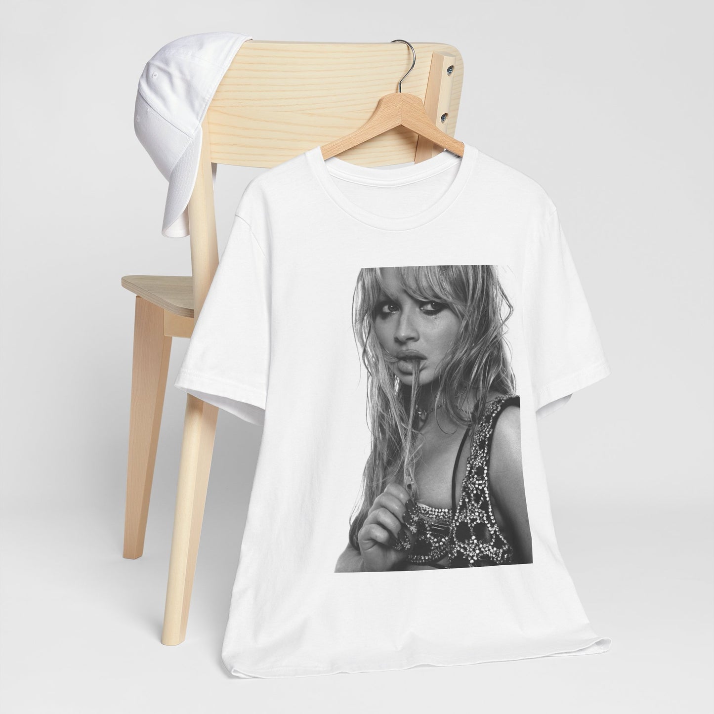 A black graphic t-shirt featuring a black and white portrait photo of Sabrina Carpenter.